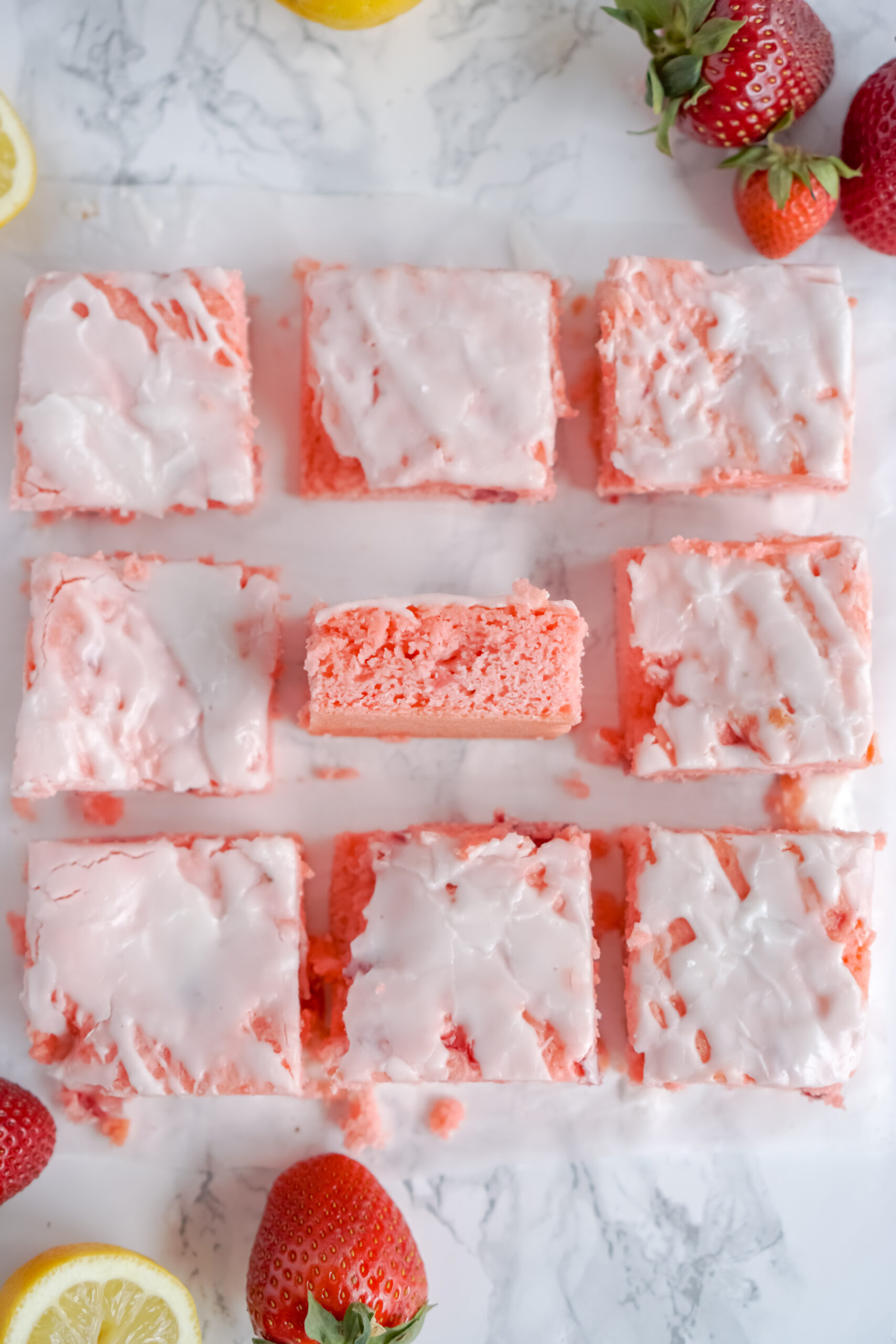Overhead view of Strawberry Lemon Brownies on a piece of parchment paper.