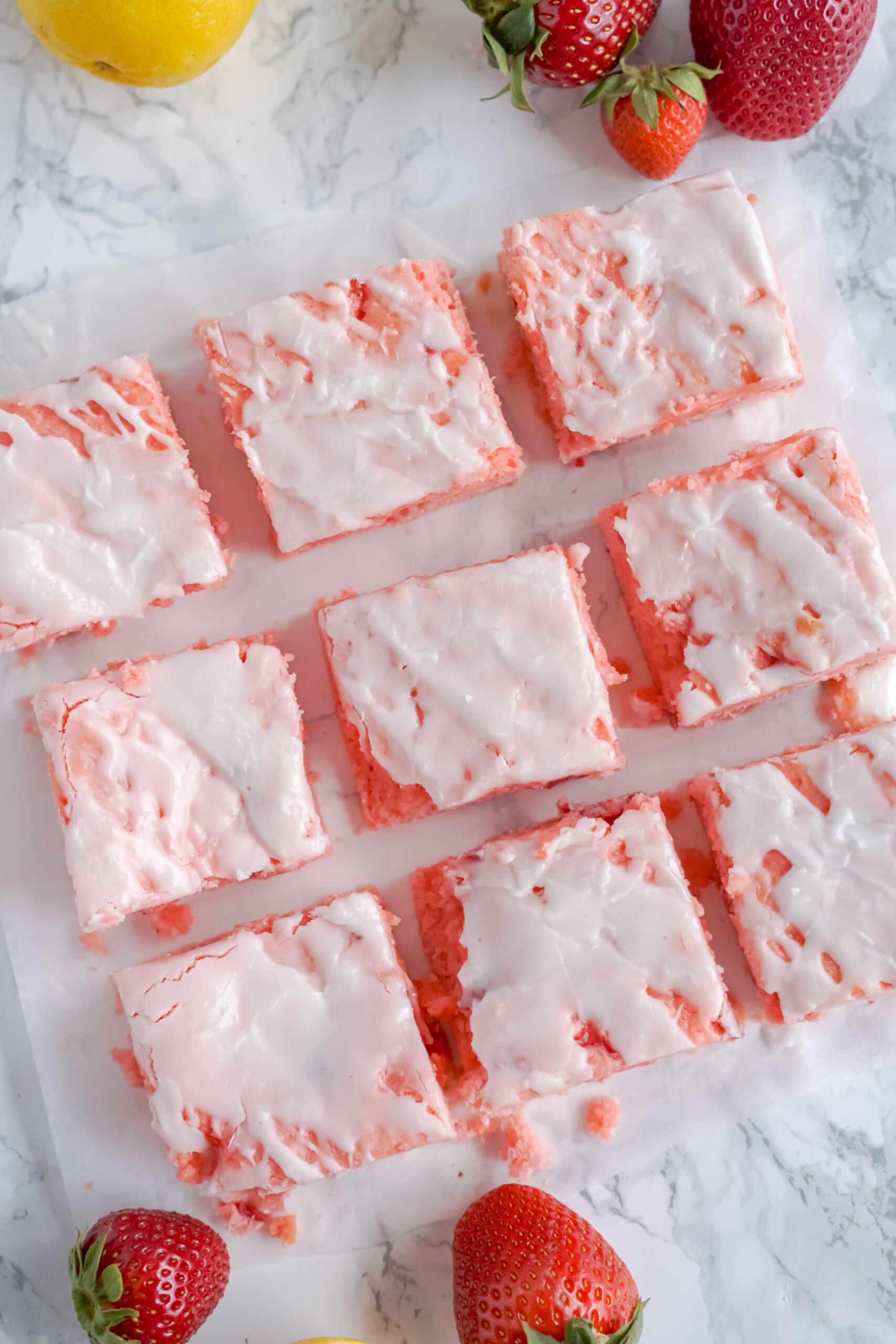 Overhead view of Strawberry Lemon Brownies on a piece of parchment paper.