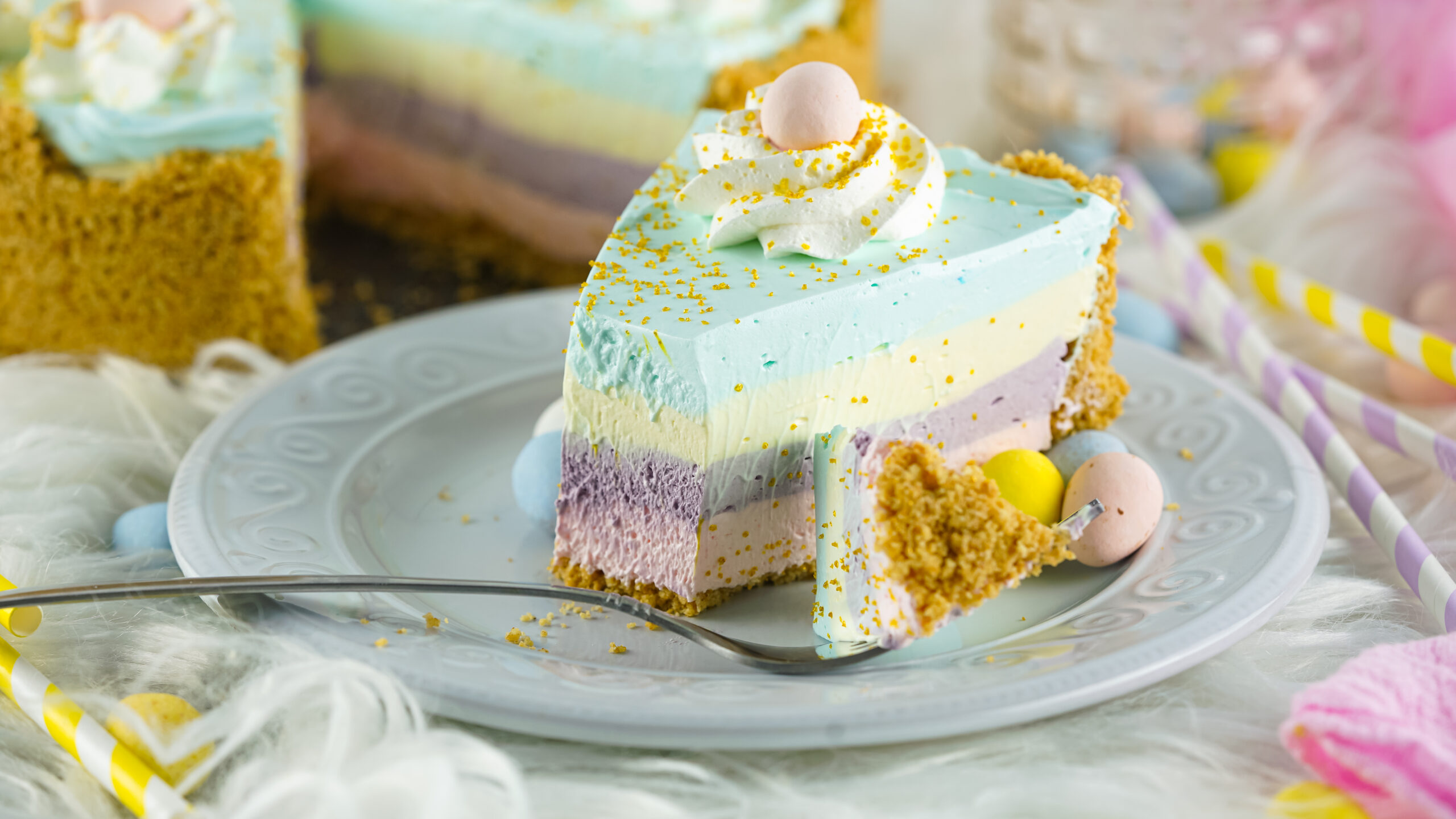side view of Easter Kool Aid Pie slice on a blue plate