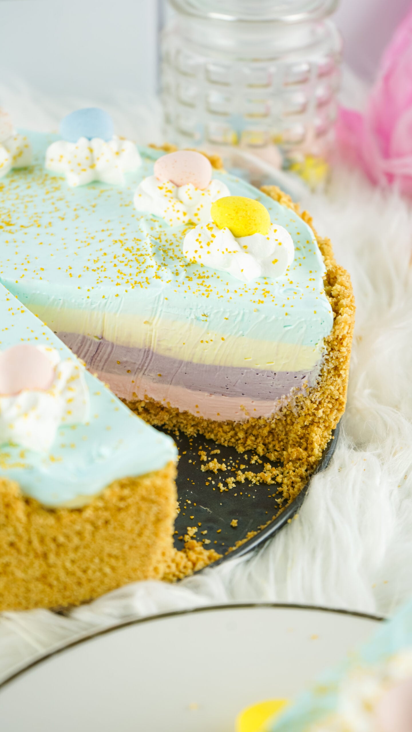 Close up view view of Easter Kool Aid Pie with a slice removed.