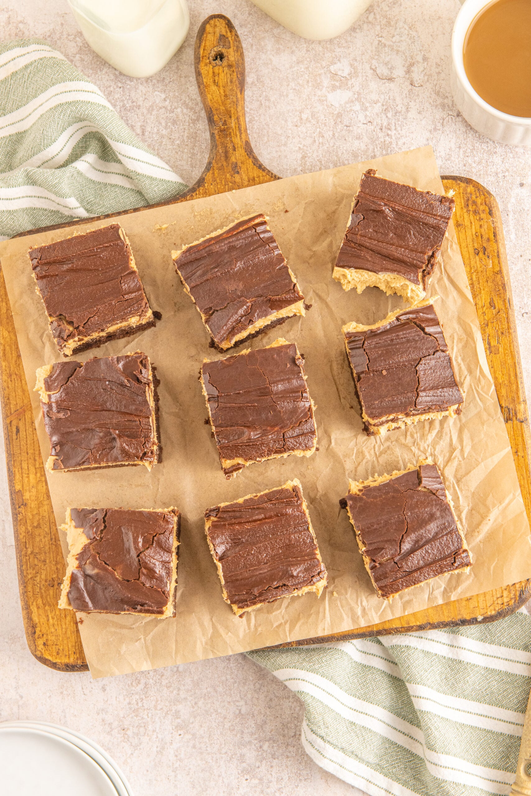 Overhead shot of Buckeye Brownies on a wooden serving board with parchment paper.
