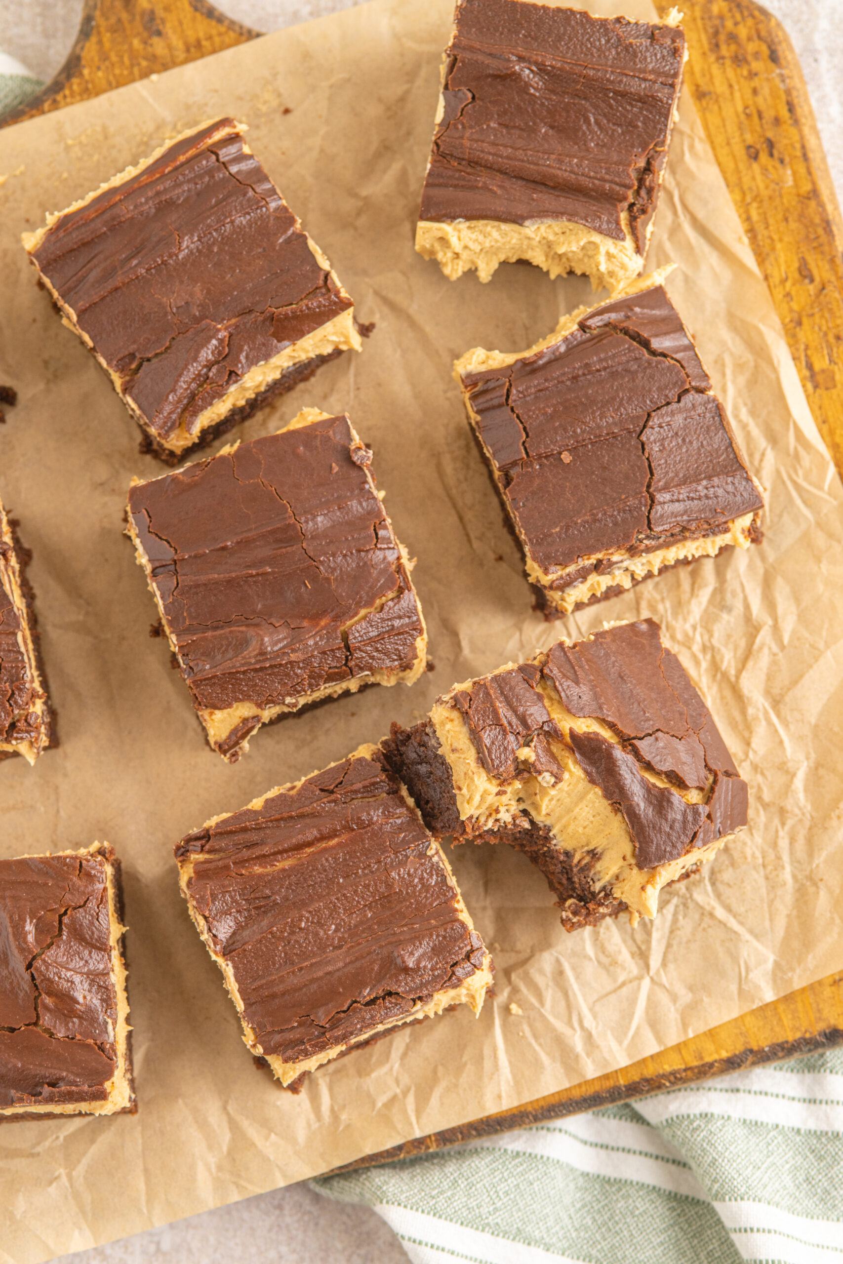 Overhead shot of Buckeye Brownies on a wooden serving board with parchment paper.