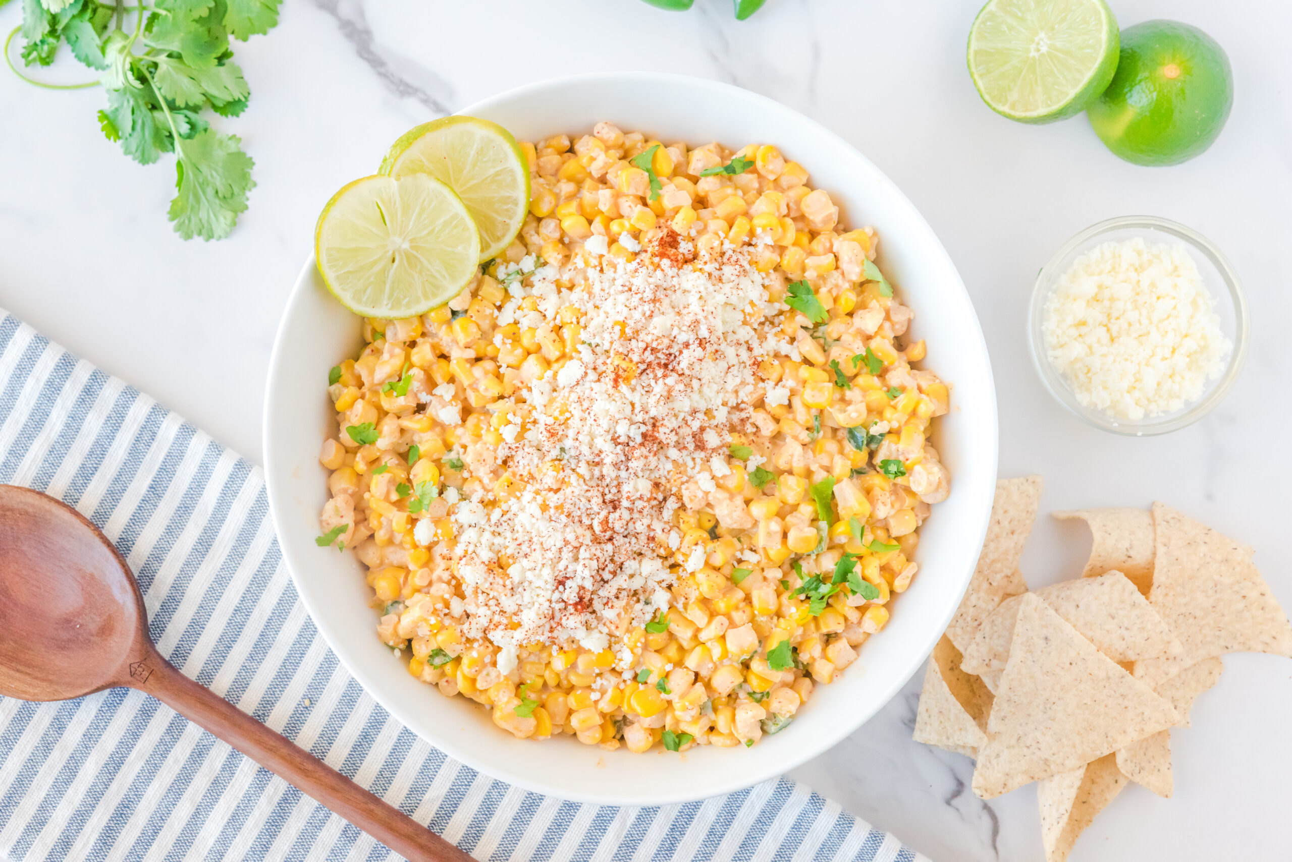 Mexican Street Corn Salad in a large white serving bowl.