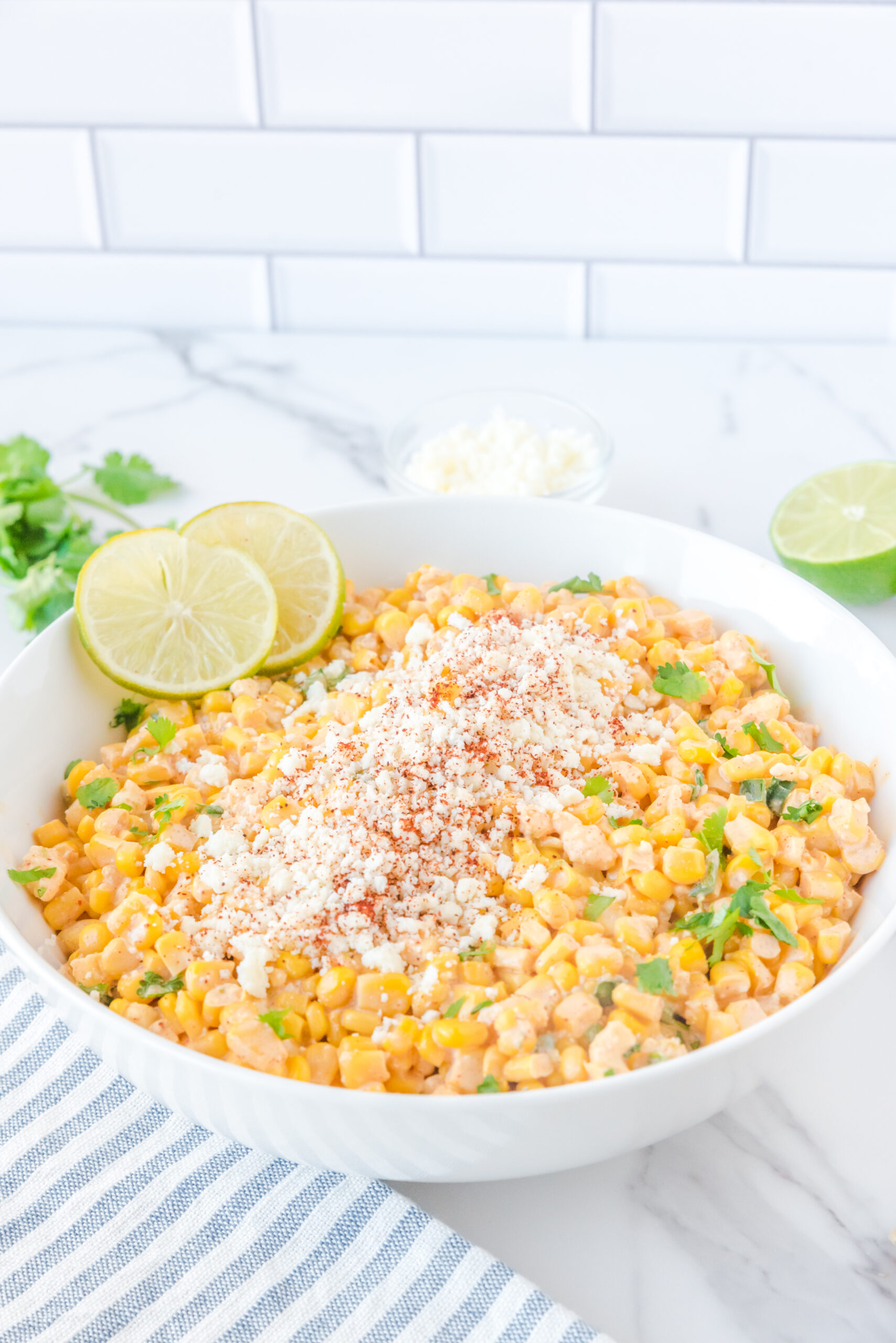 Mexican Street Corn Salad in a large white serving bowl.