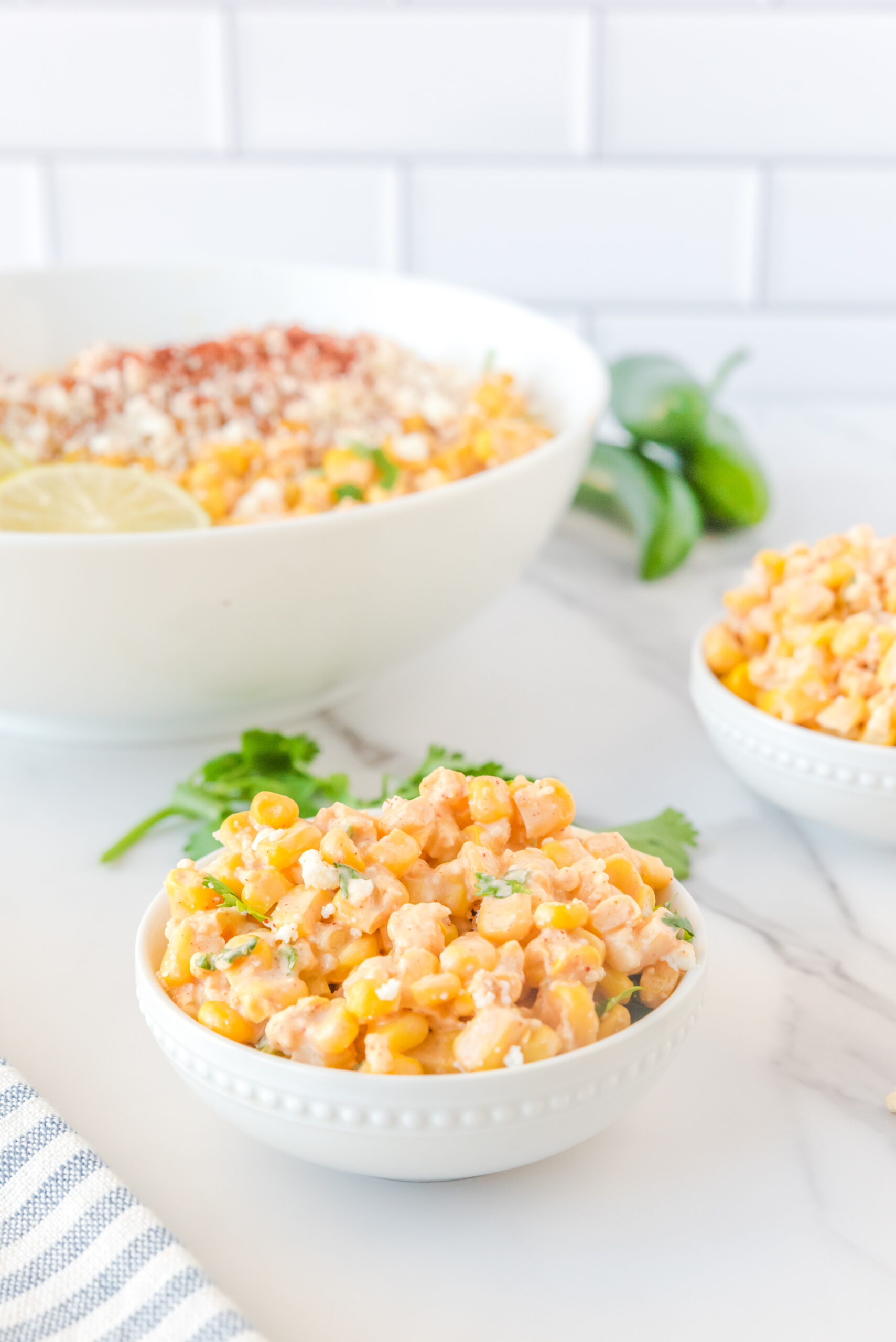 Mexican Street Corn Salad in a small white serving bowl.