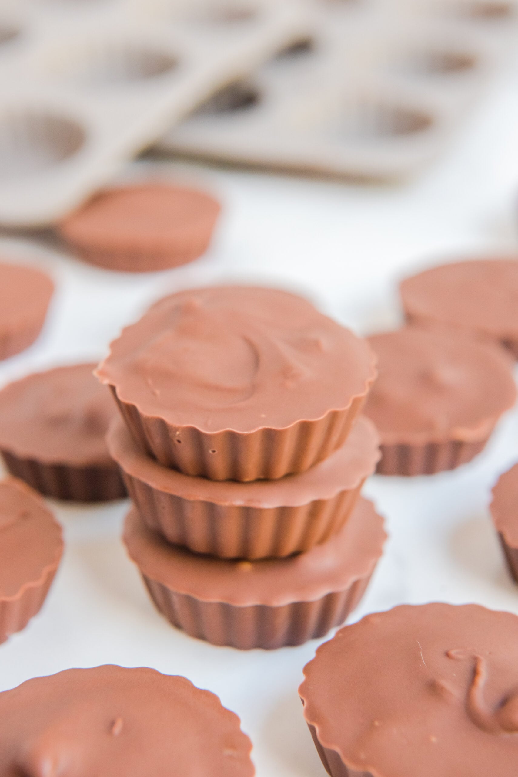 Three Homemade Reese's Peanut Butter Cups stacked on top of each other.