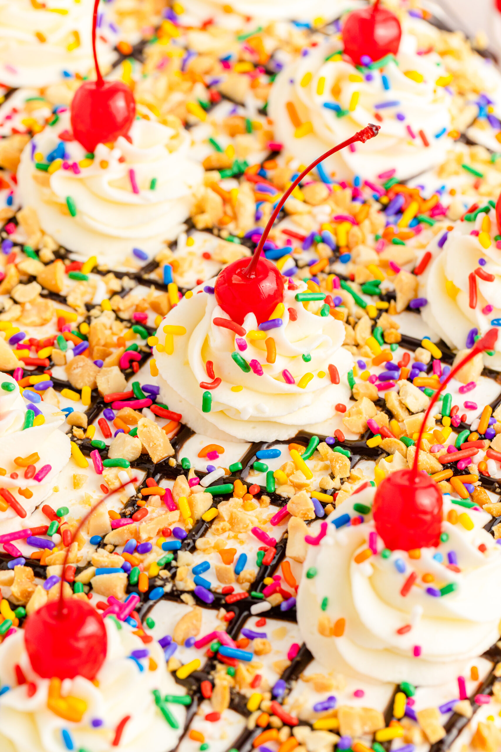Close up view of No Bake Banana Split Cake in a clear baking dish.