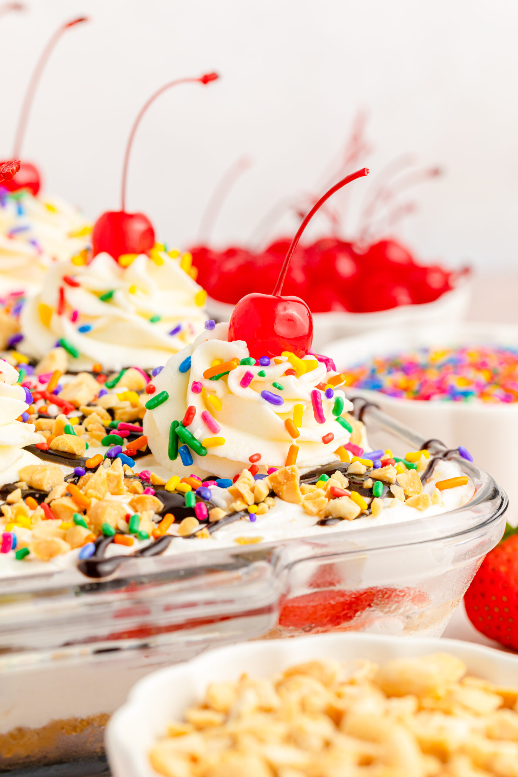 Front view of No Bake Banana Split Cake in a clear baking dish.