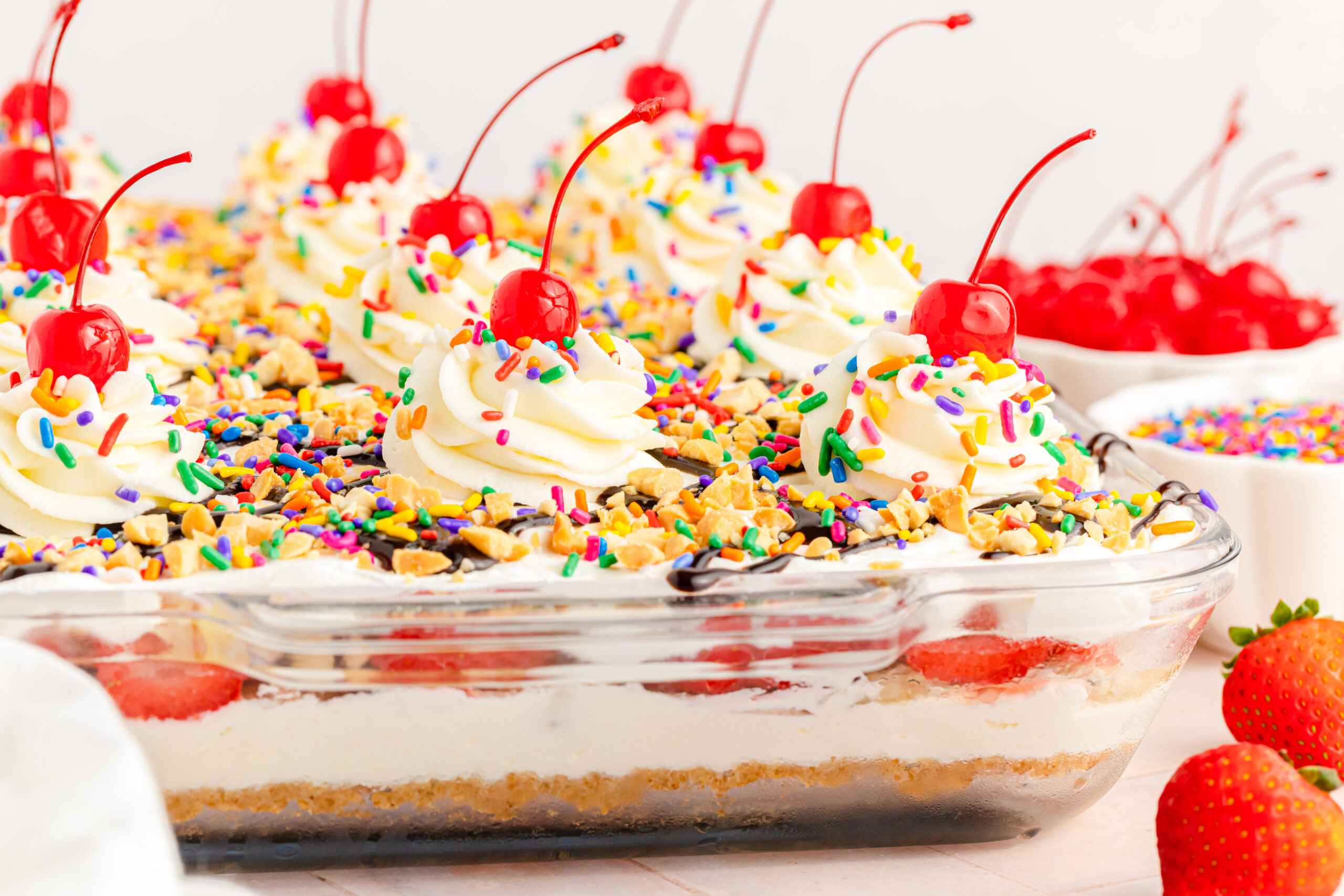 Front view of No Bake Banana Split Cake in a clear baking dish.