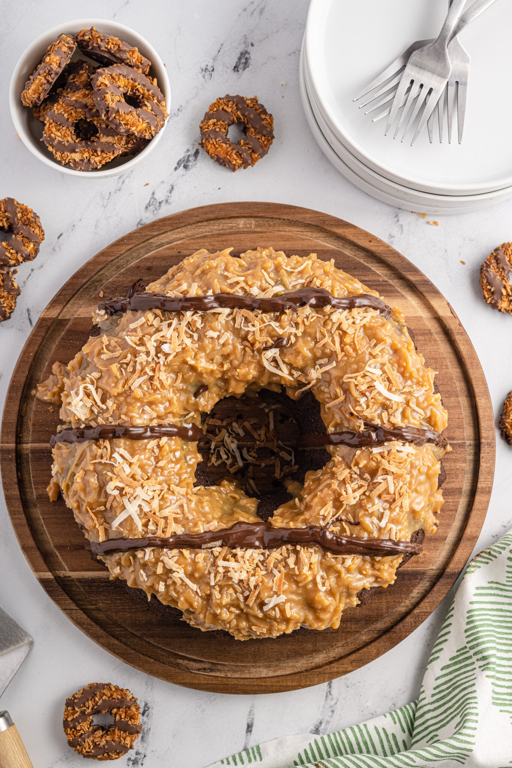 Overhead view of Samoa Cake on a wooden cutting board.