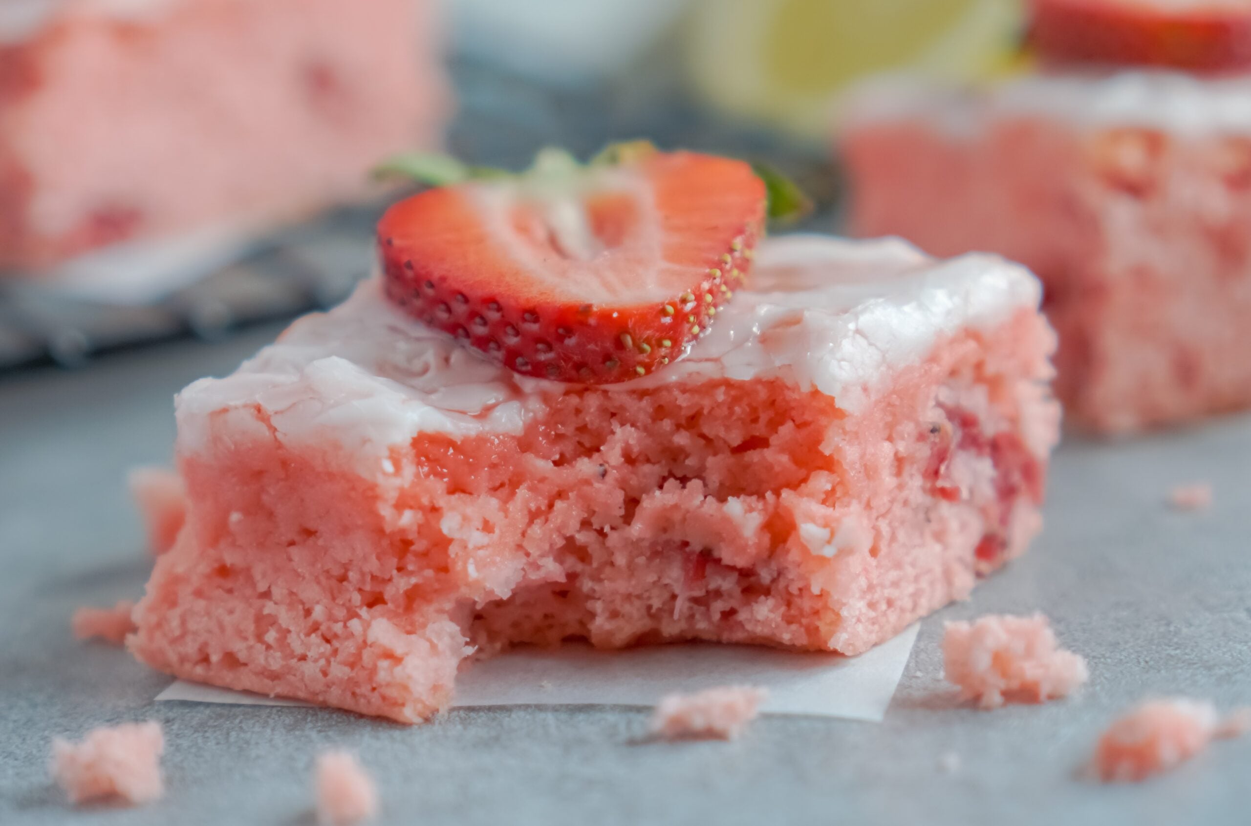 Front view of a Strawberry Lemon Brownie with a bite missing
