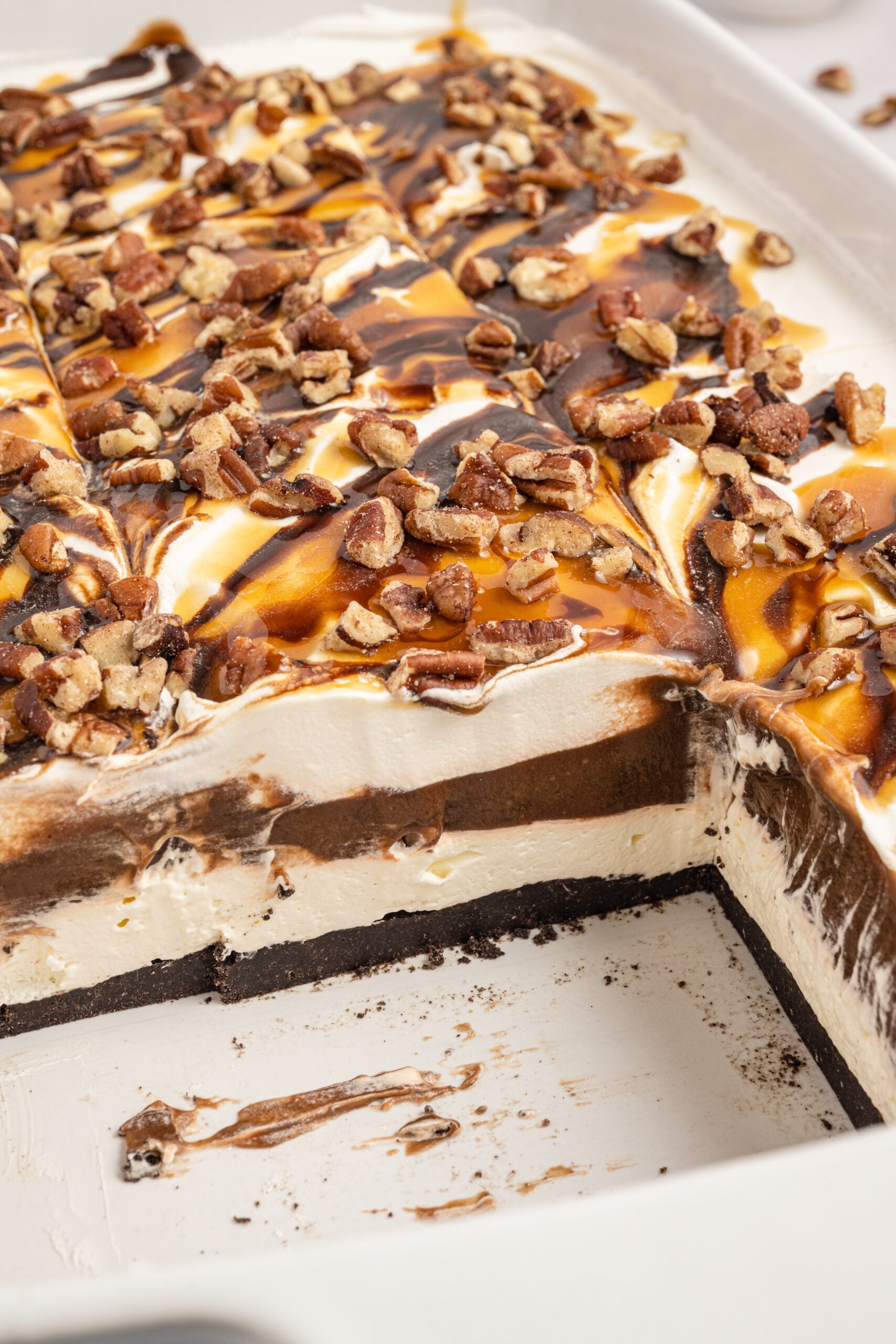 Close up view of Turtle Lush in a white baking dish with two slices removed.