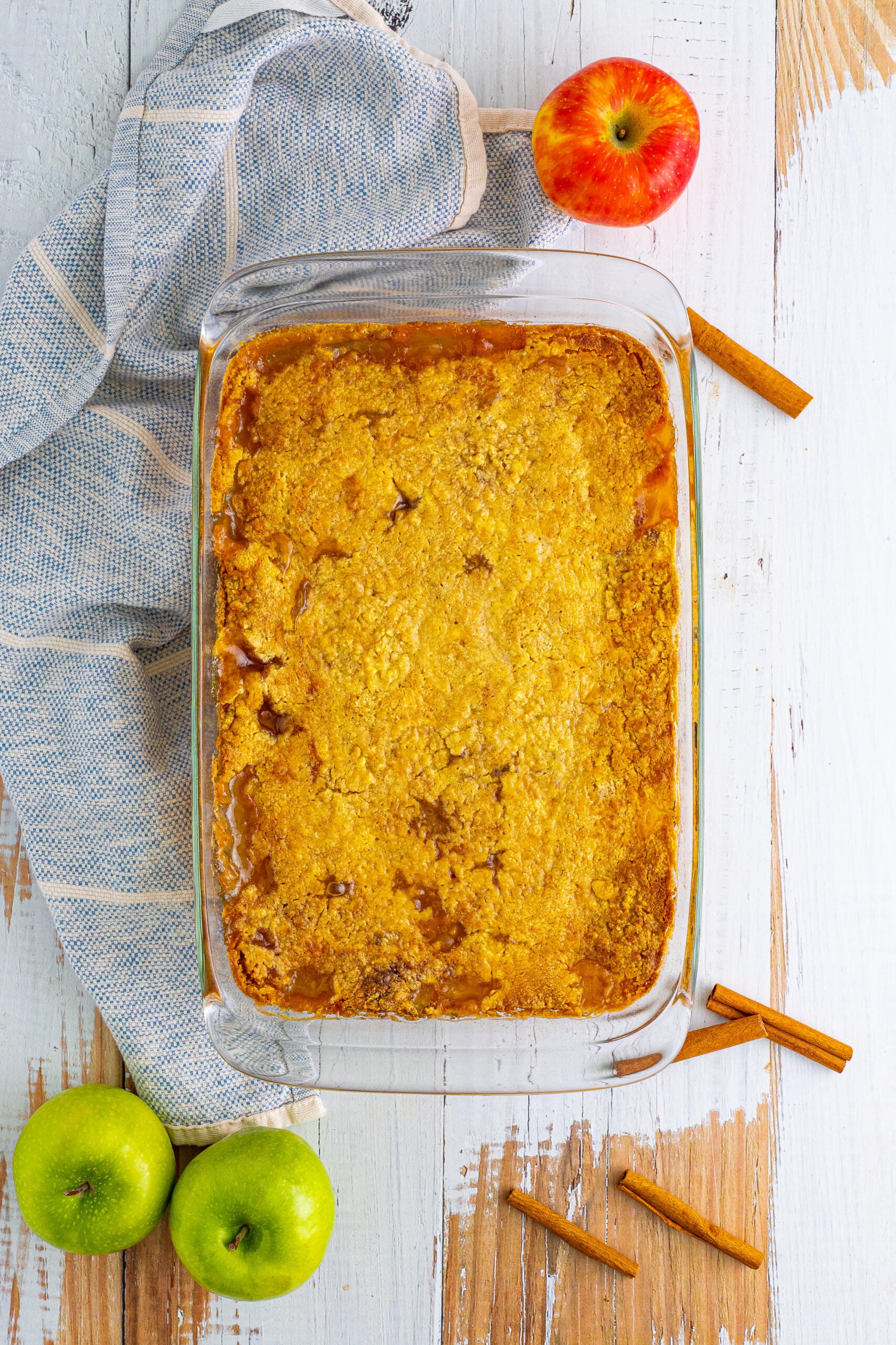 Overhead shot of the caramel apple dump cake in a clear baking dish.