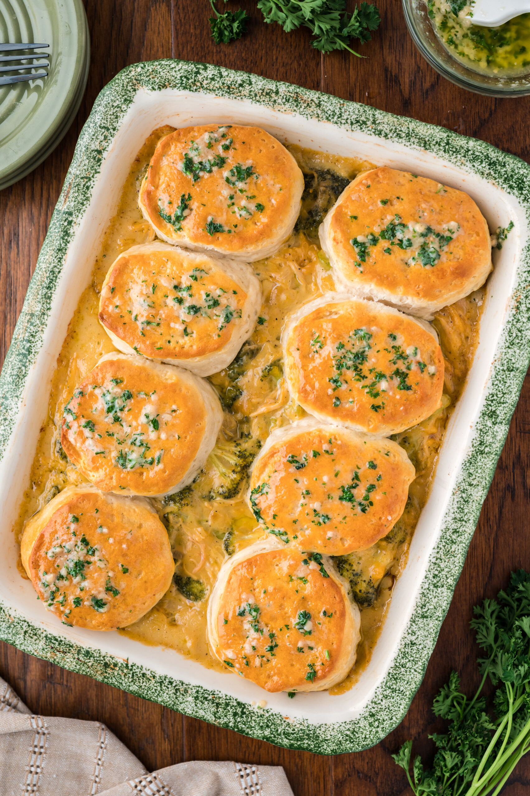 Overhead view of Broccoli Cheddar Biscuit Casserole in a baking dish.