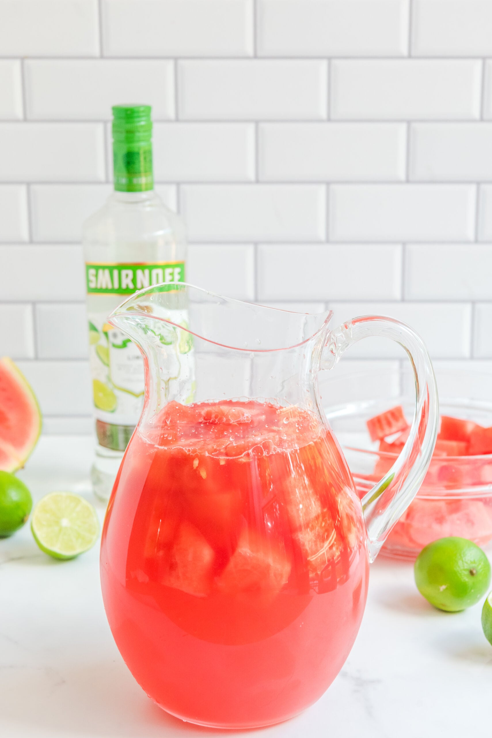 Front view of a glass pitcher full of Watermelon Cocktail.