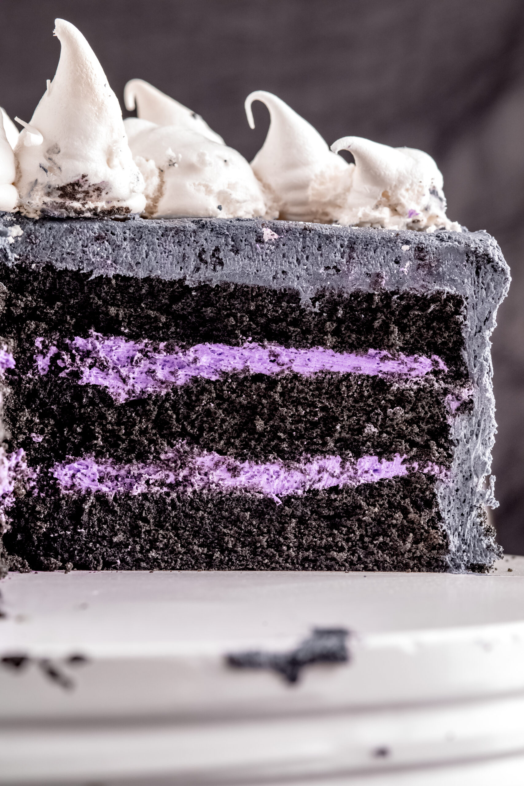 A side view of the cut Halloween Cake showing the black and purple layers.