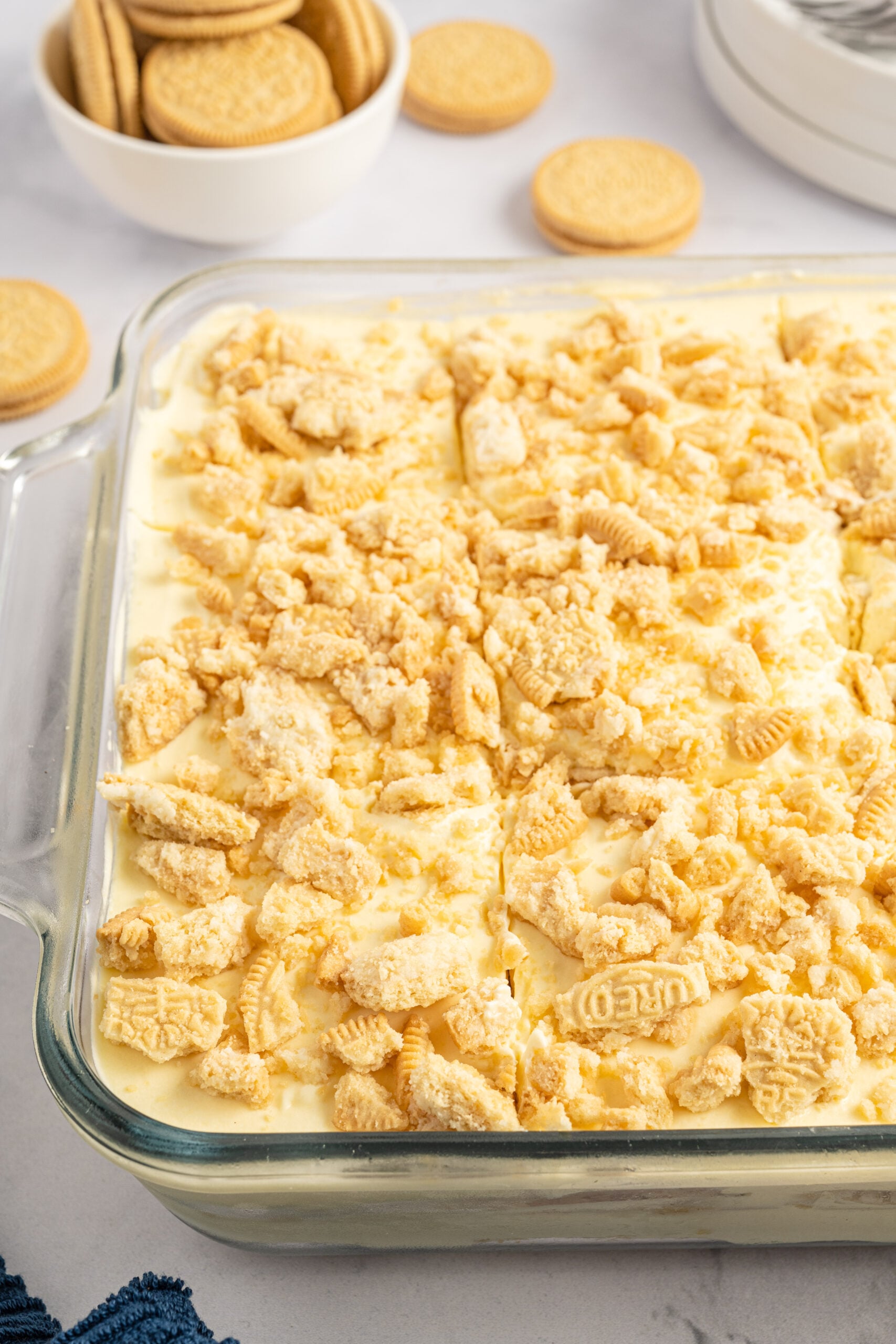 Close up view of Golden Oreo Icebox Cake in a clear baking dish.