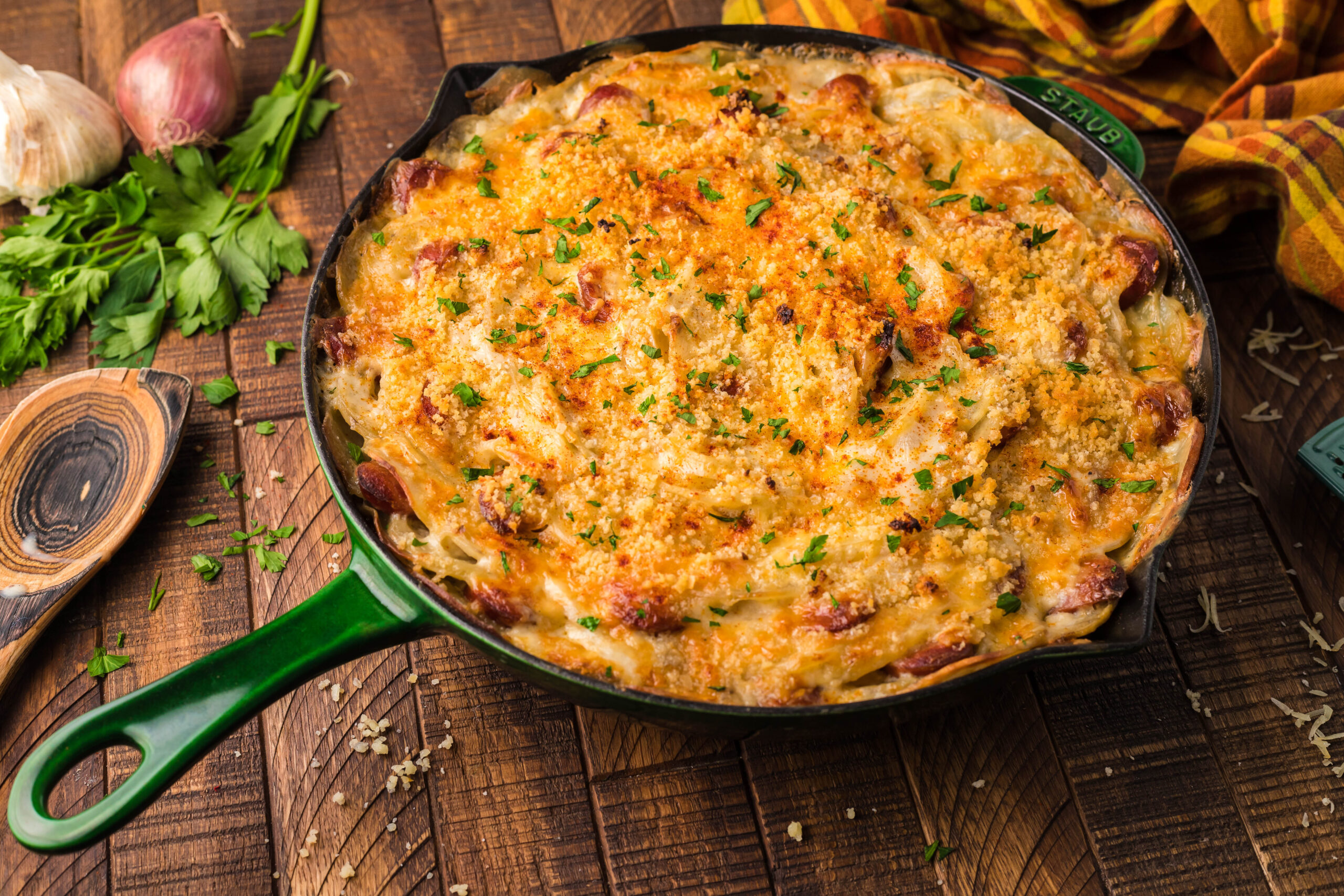 Side view of Au Gratin Potatoes & Ham in a cast iron skillet.