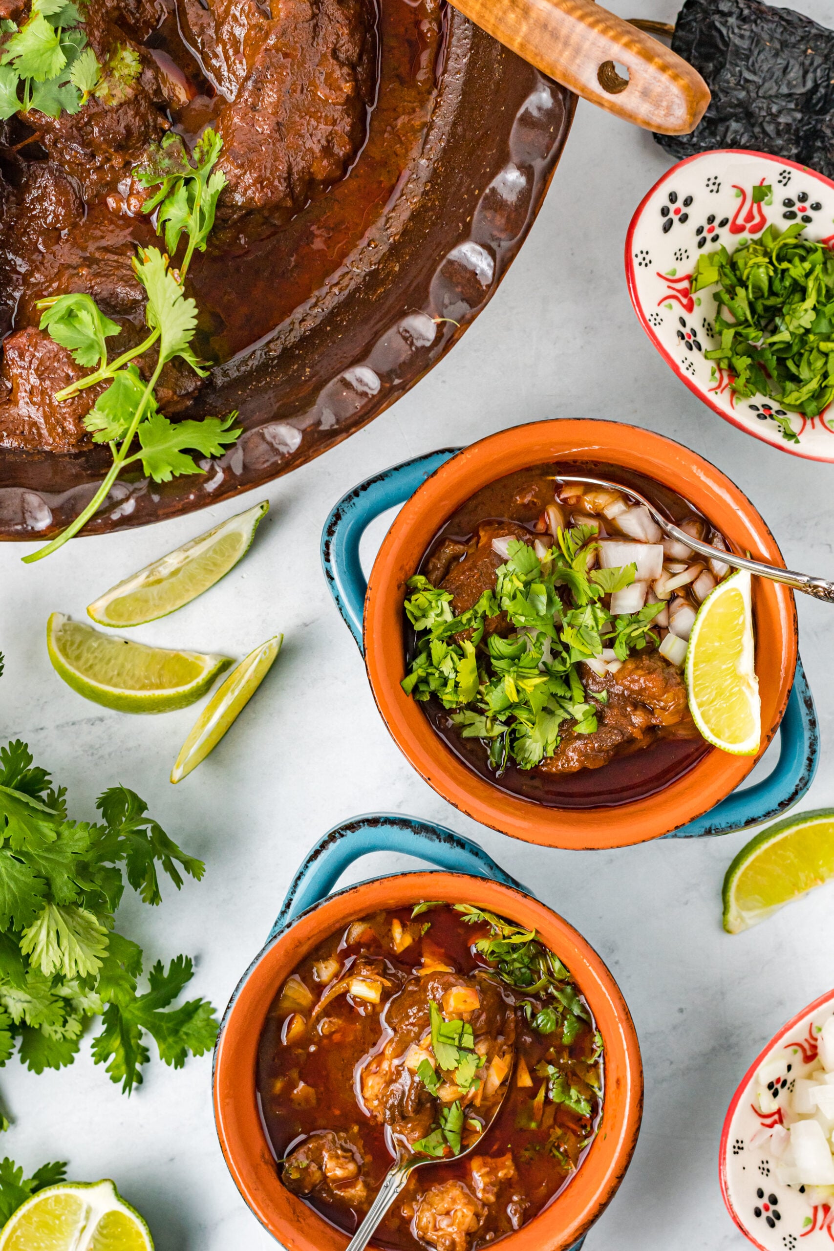 Overhead view of Beef Birria in two bowls.