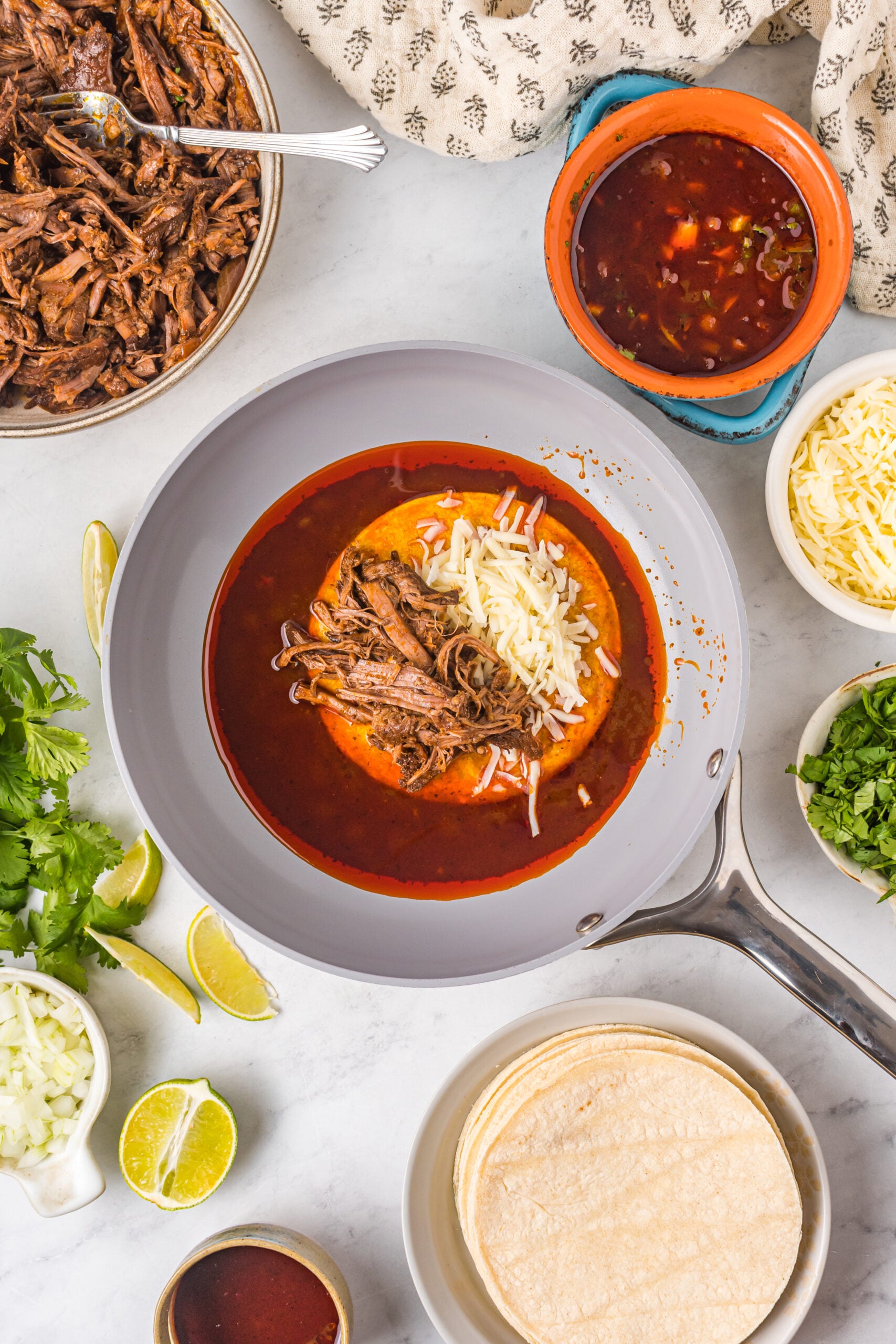 Overhead view of Birria Tacos being made.