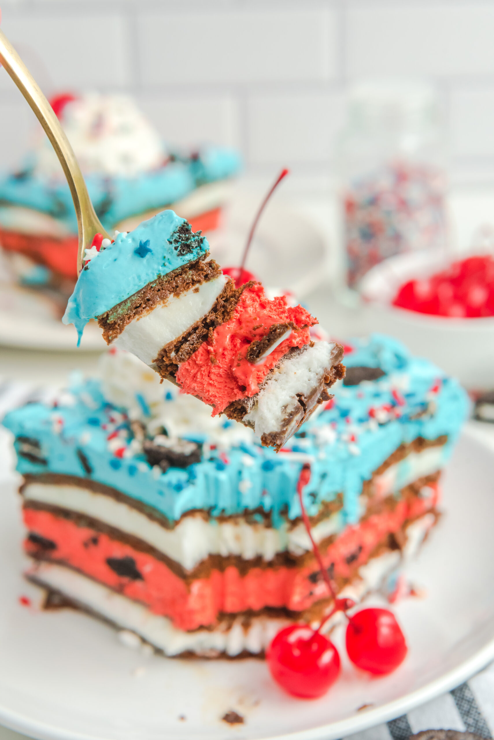 Close up view of a bite of Patriotic Ice Cream Sandwich Cake.