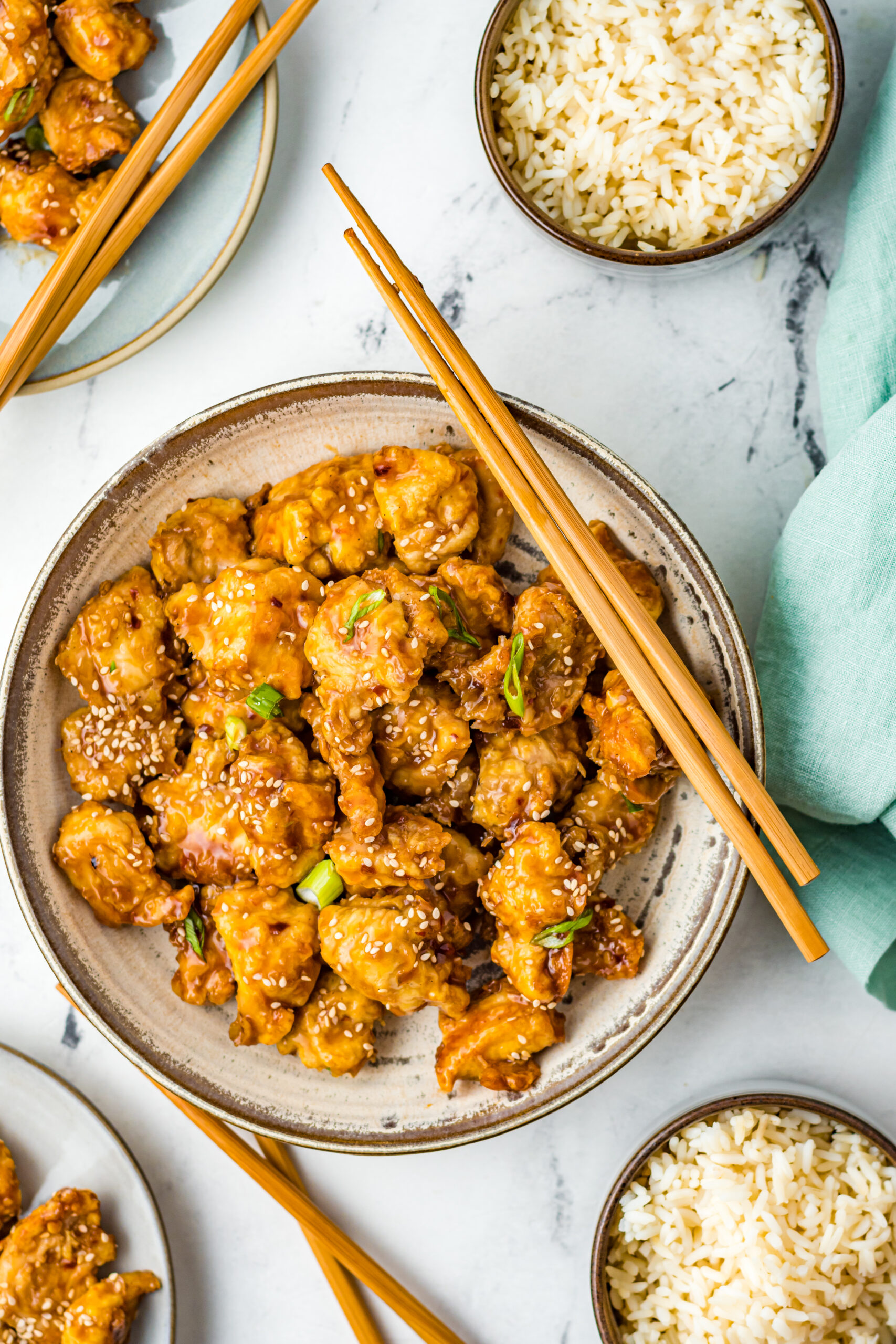 Overhead view of Air Fryer General Tsos Chicken in a gray dish.