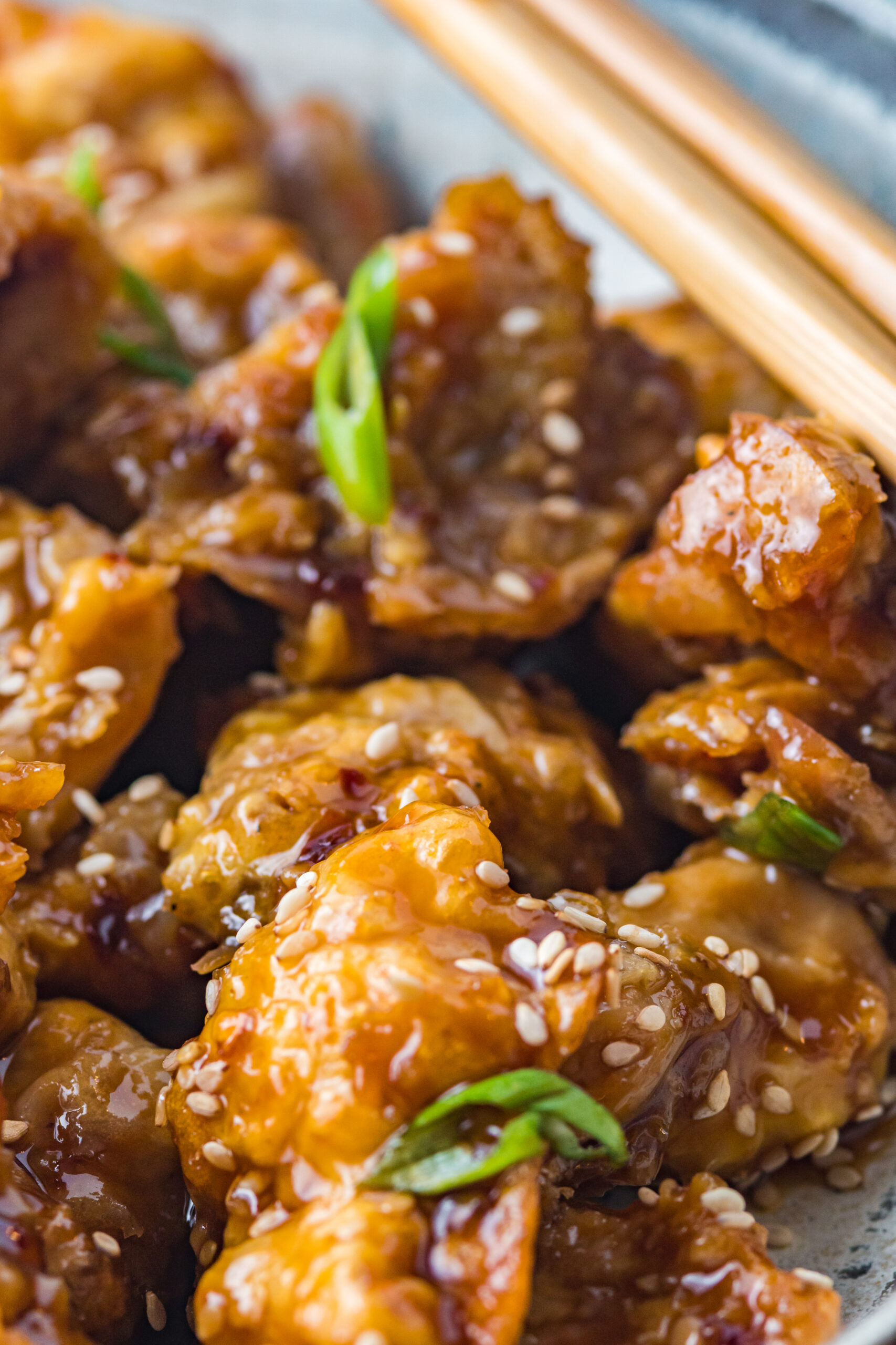 Close up view of Air Fryer General Tsos Chicken in a gray dish.