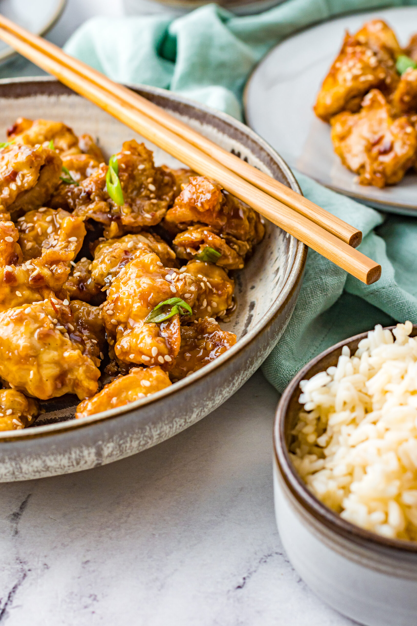 Close up view of Air Fryer General Tsos Chicken in a gray dish.