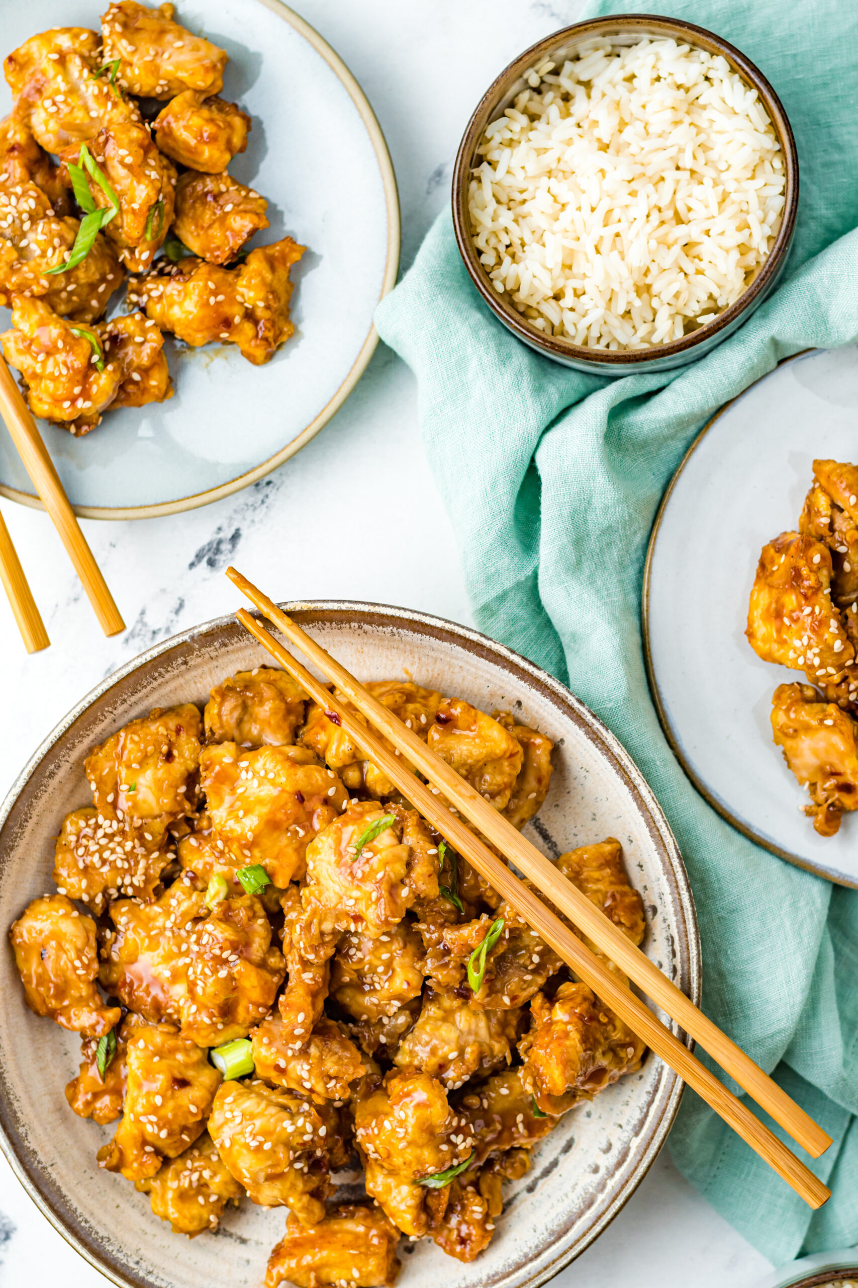 Overhead view of Air Fryer General Tsos Chicken in a gray dish.