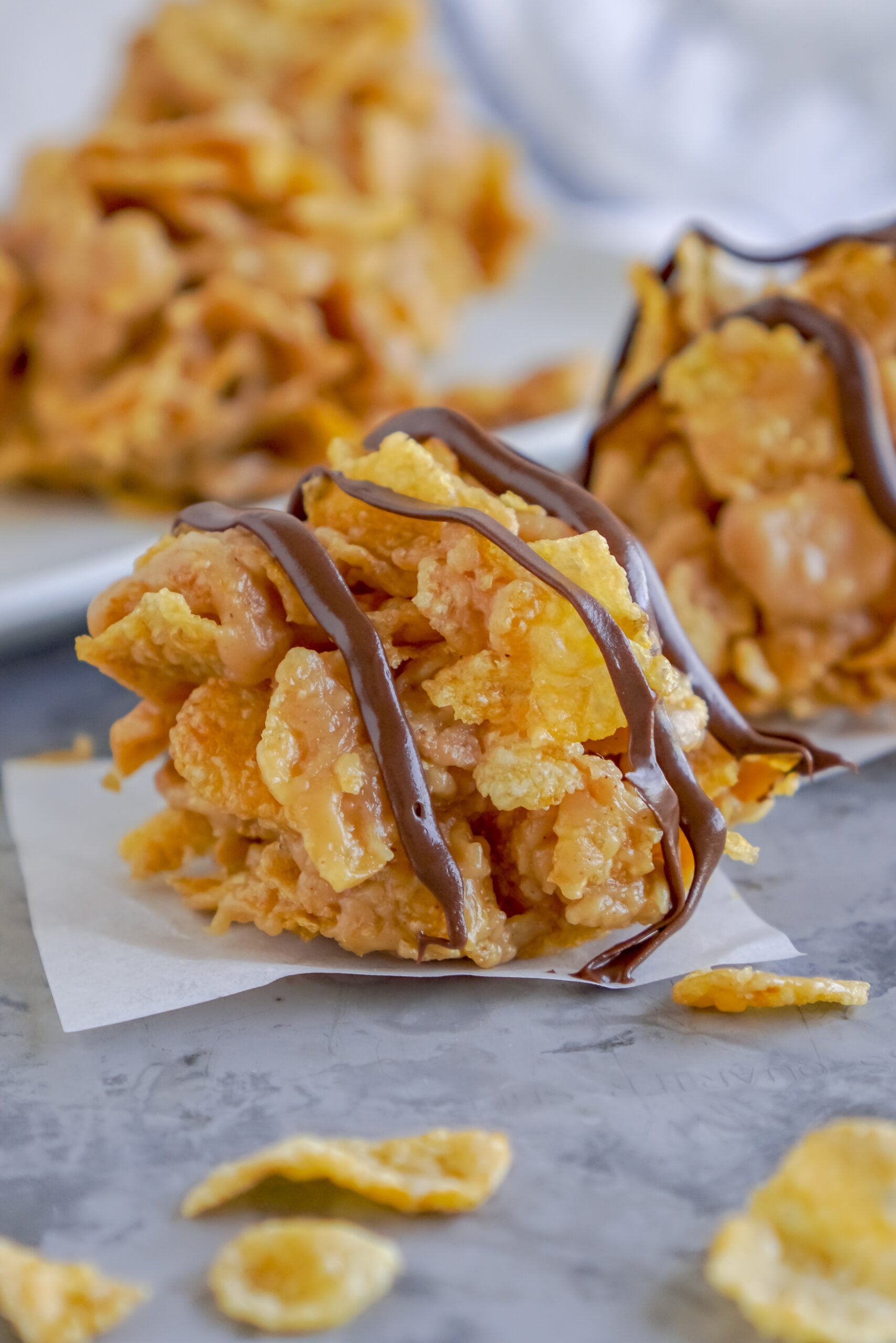 Peanut butter cornflake cookies drizzled with chocolate