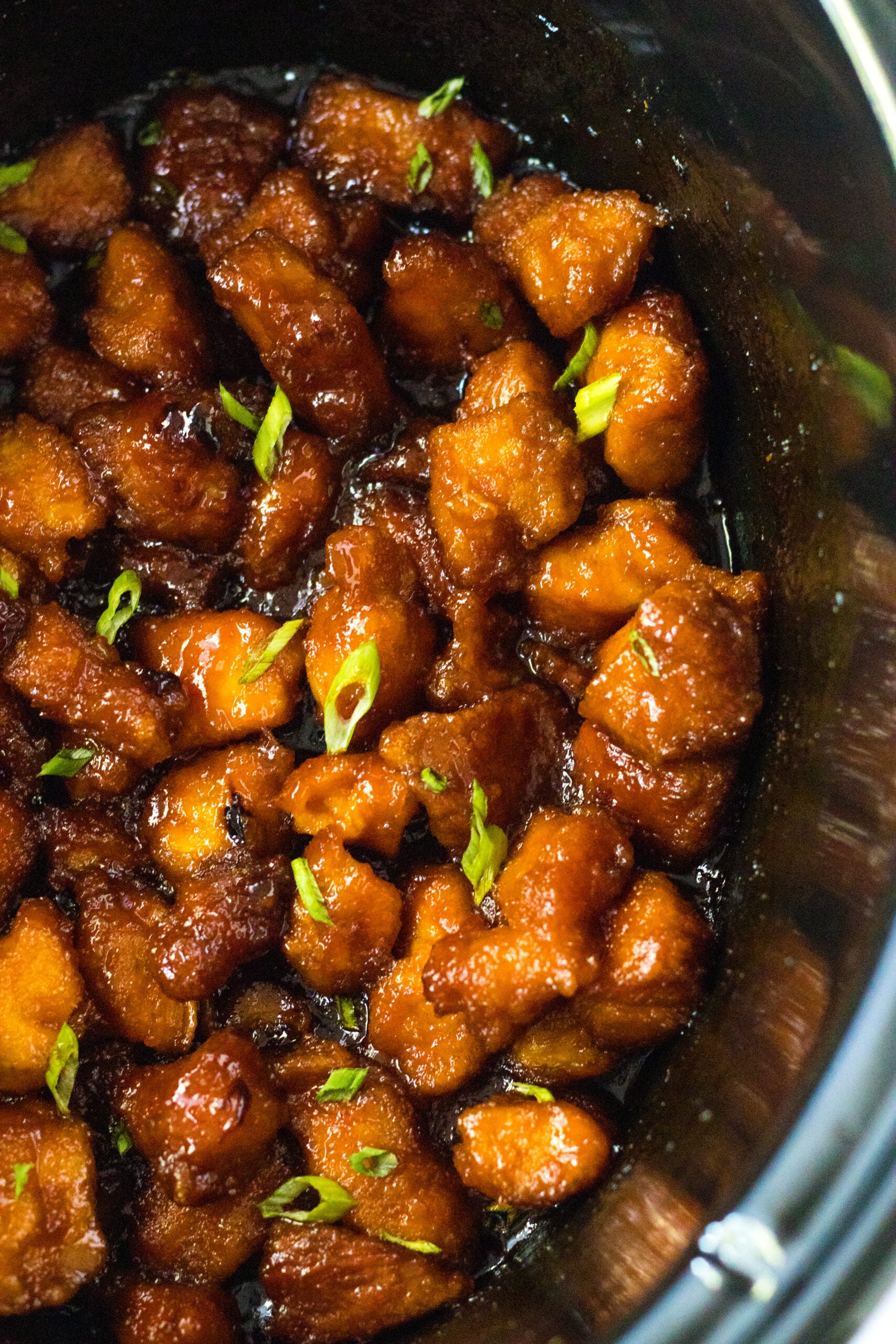 Overhead view of Slow Cooker Firecracker Chicken in a crock pot.