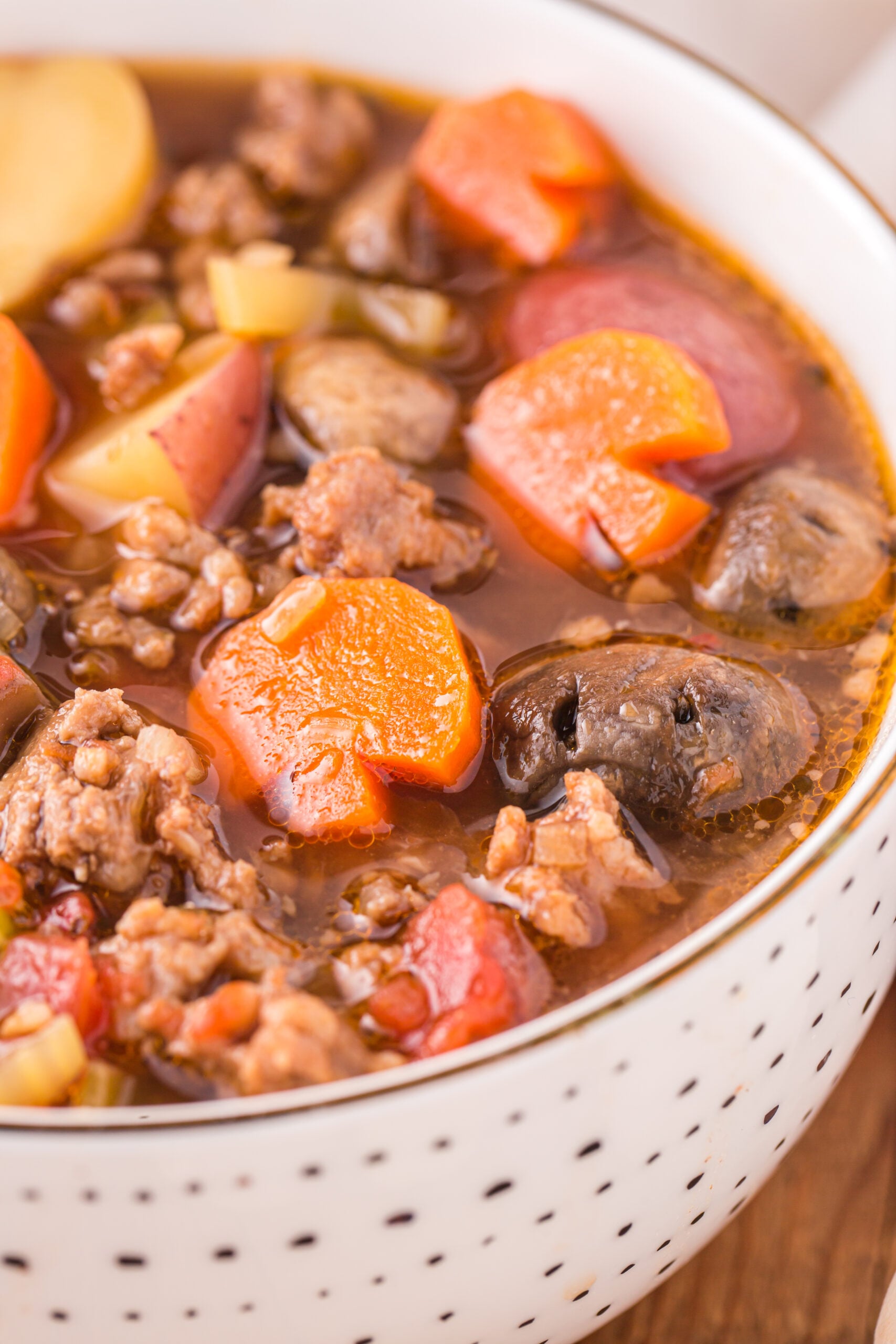 Close up view of a serving of Witches Brew Stew in a bowl.