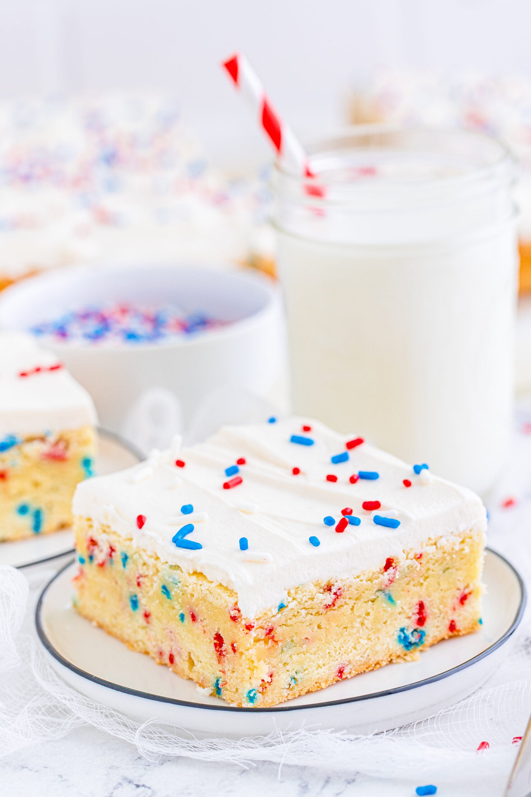 Front view of a Patriotic Sugar Cookie Bar on a white dish.