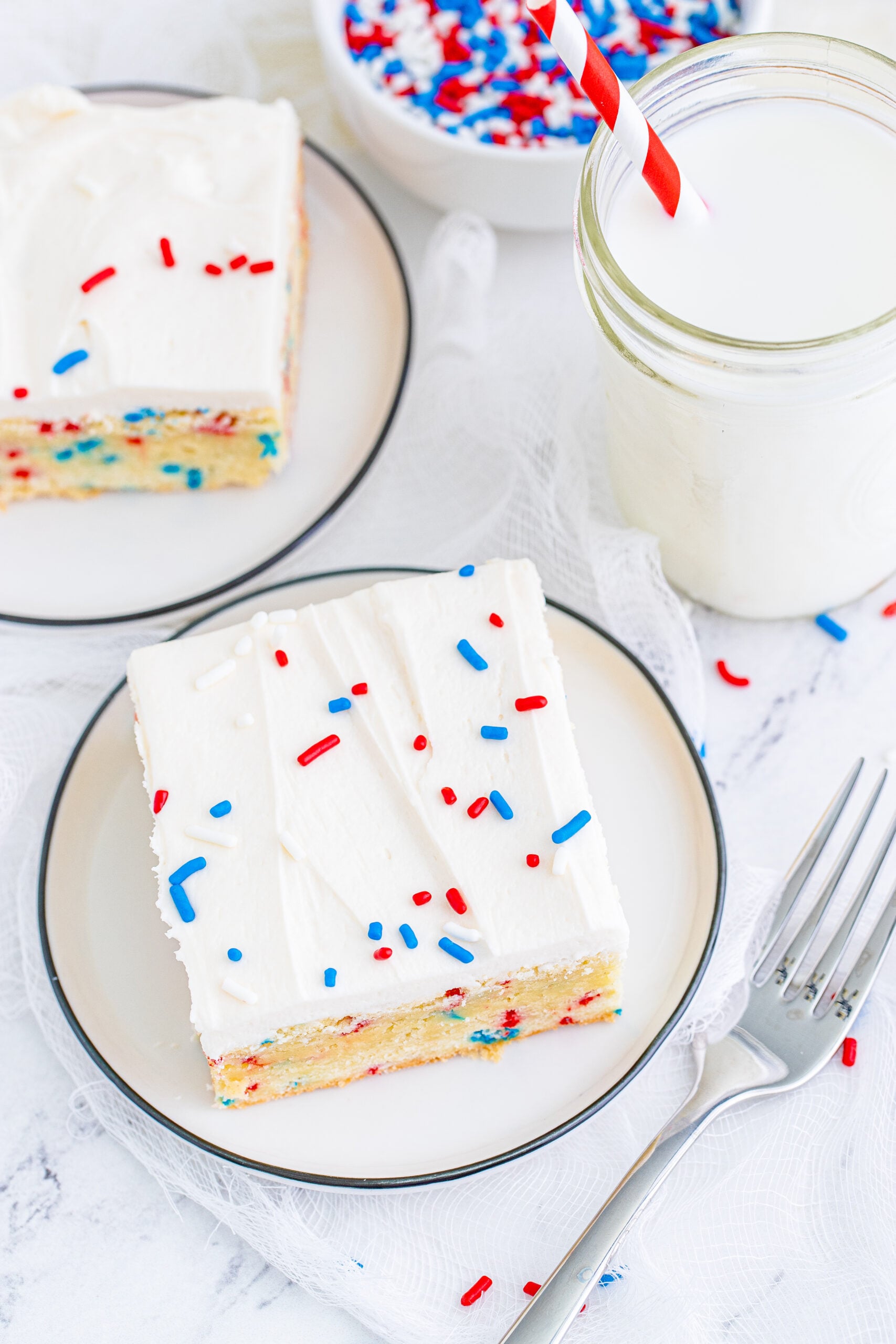 Overhead view of a Patriotic Sugar Cookie Bar on a white plate.