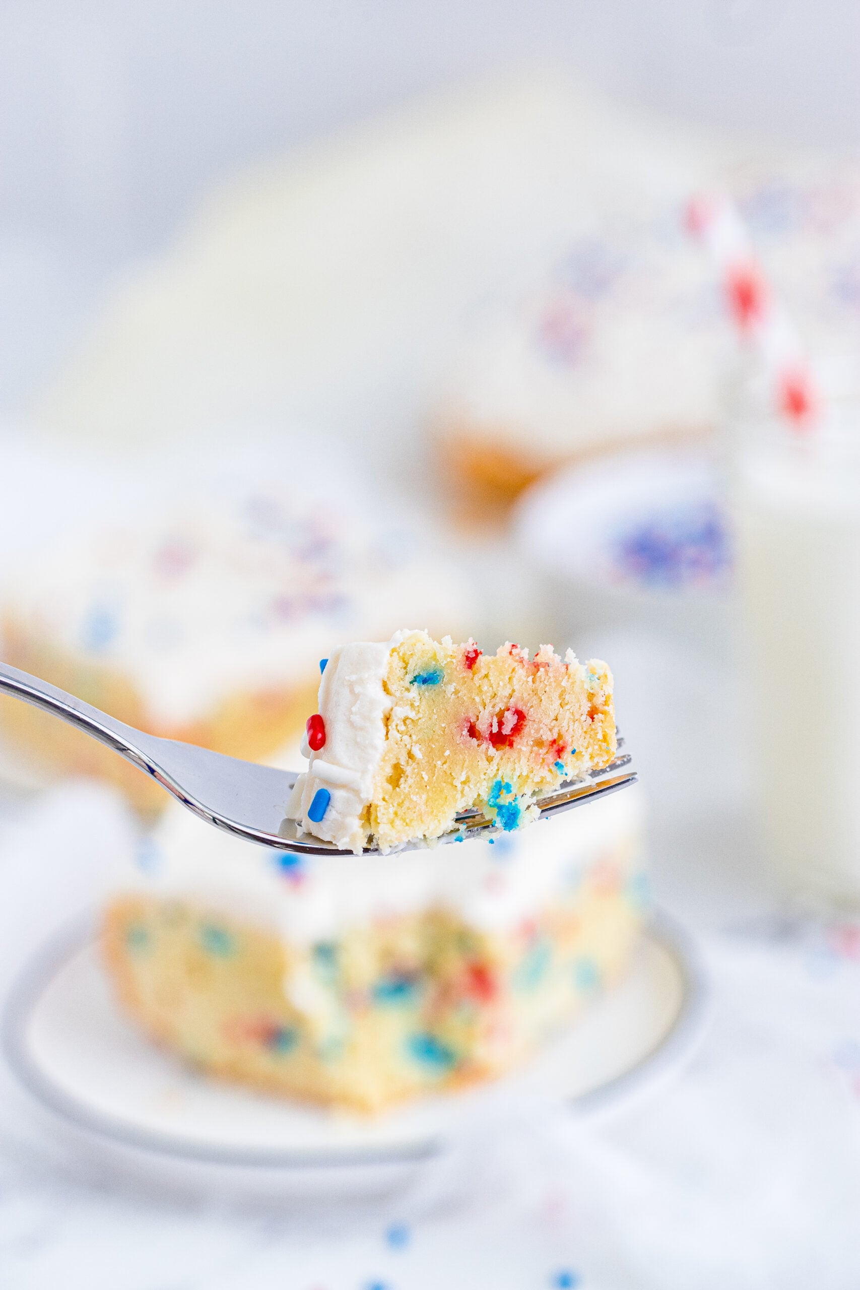 Close up view of a bite of a Patriotic Sugar Cookie Bar.