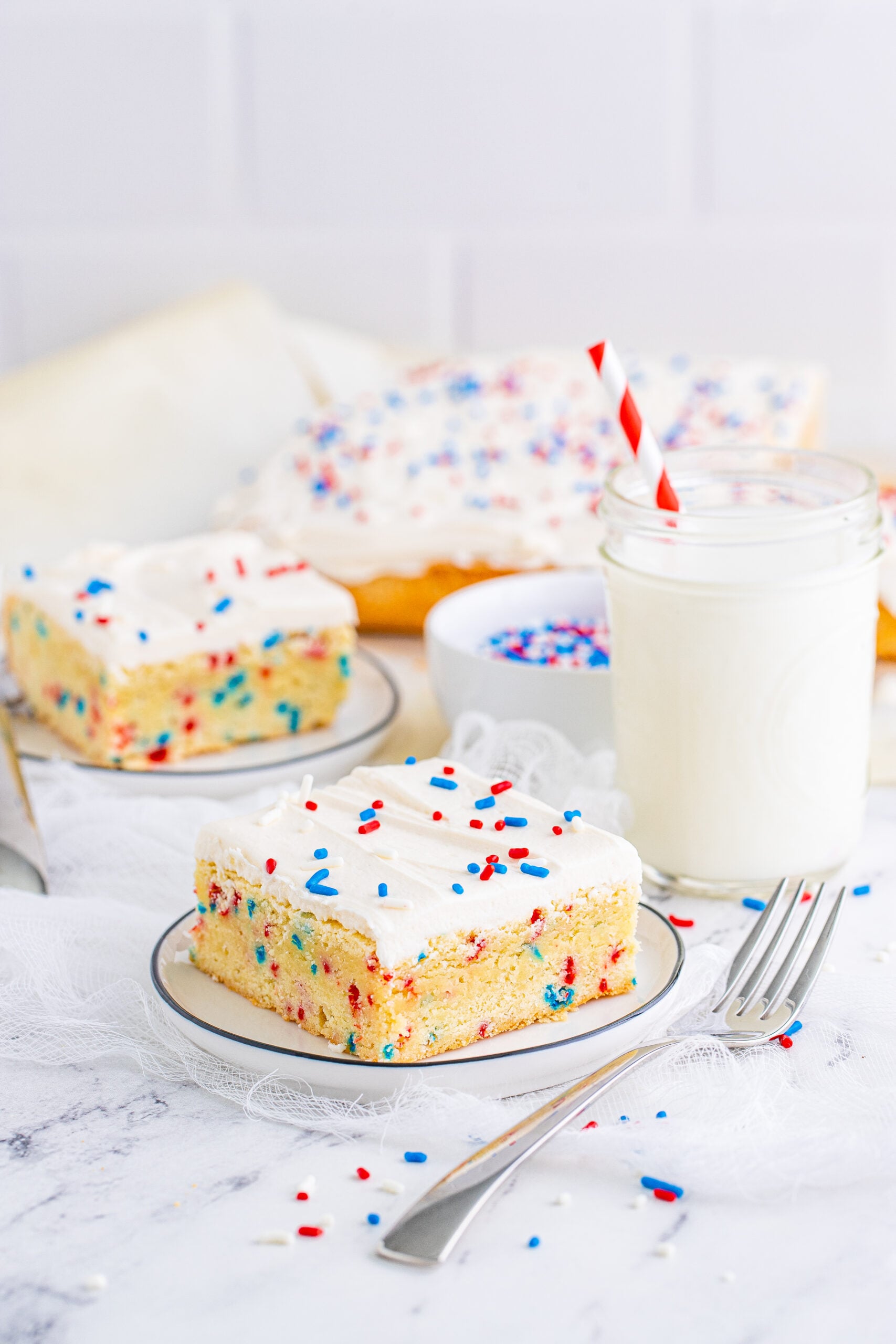 Front view of a Patriotic Sugar Cookie Bar on a white plate.
