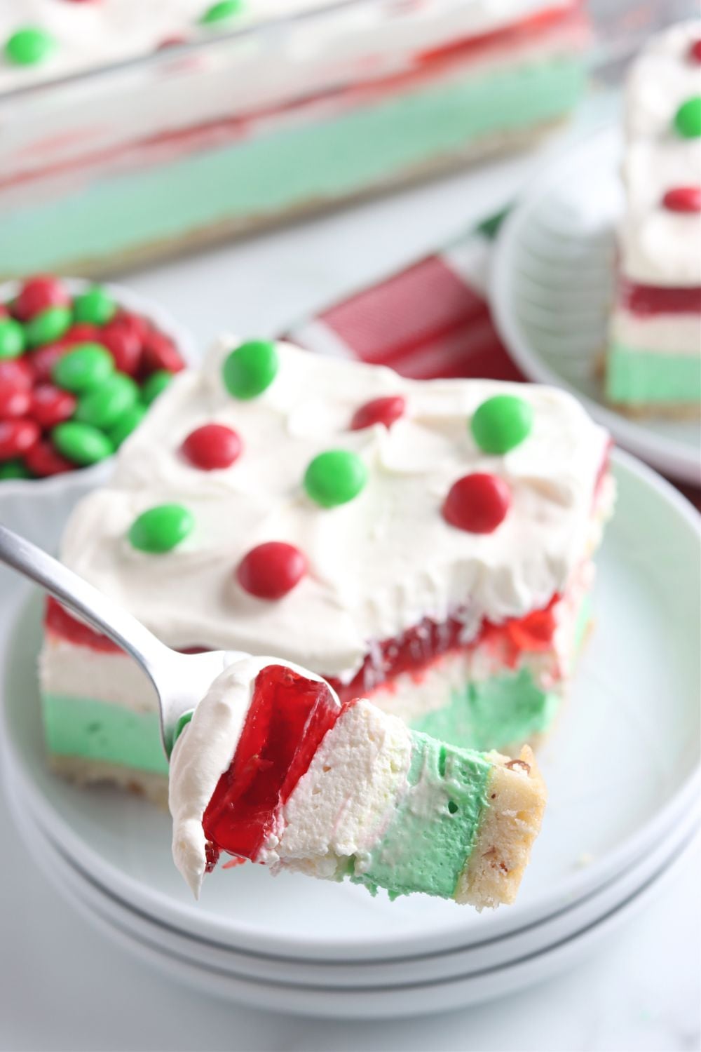 fork with a Christmas dessert on it above plate