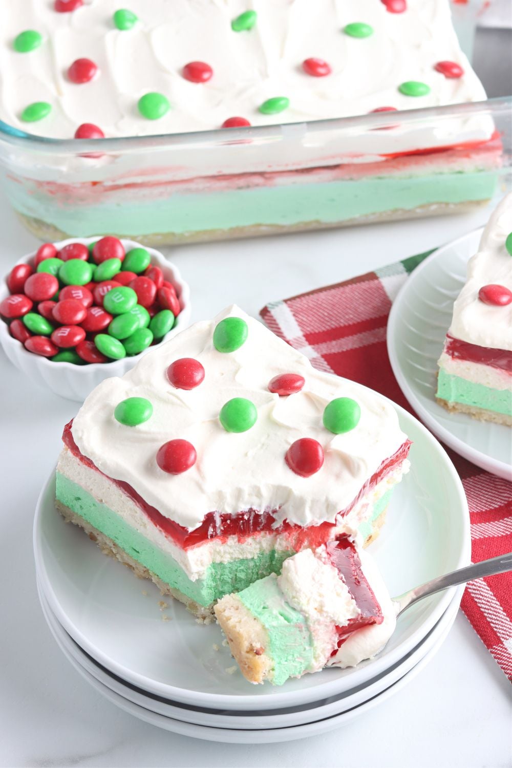 bite on fork of Christmas dessert lasagna sitting on plate
