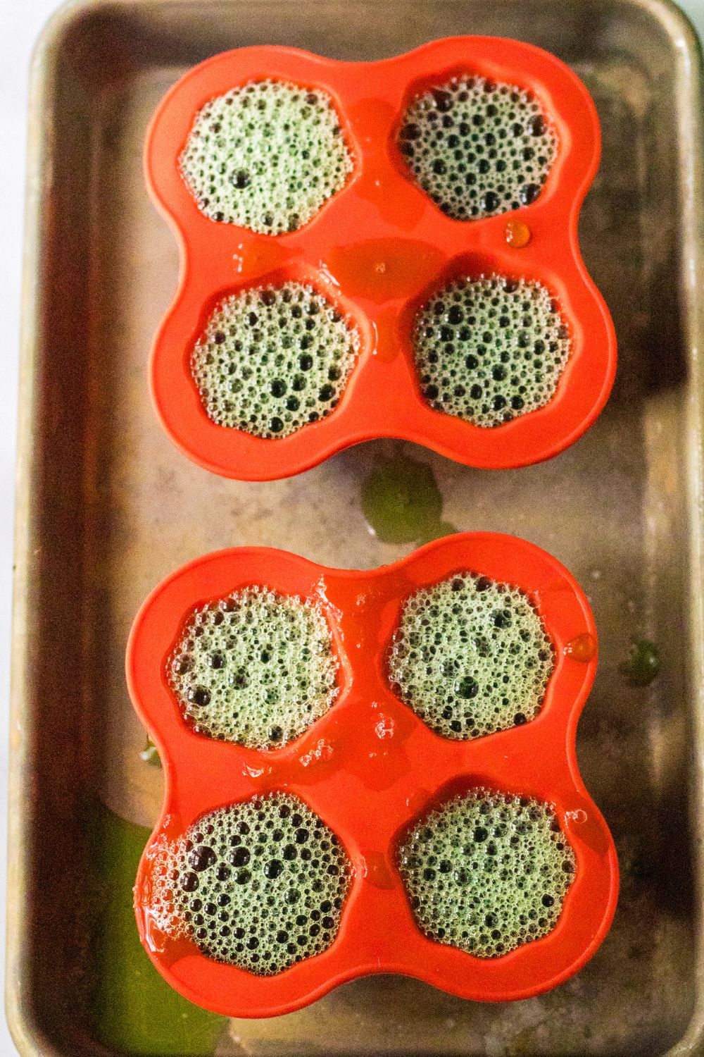 silicone molds on baking sheet filled with jello