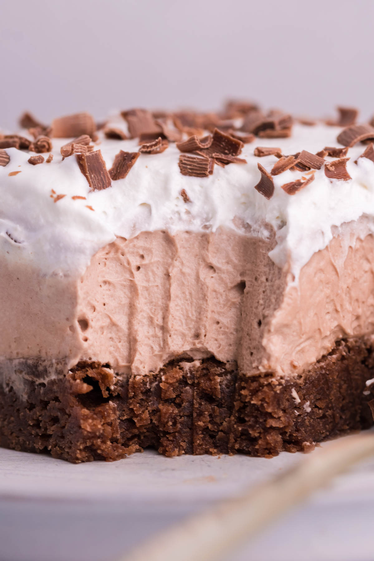 Up close shot of the French Silk Brownies with fork bite taken out on plate