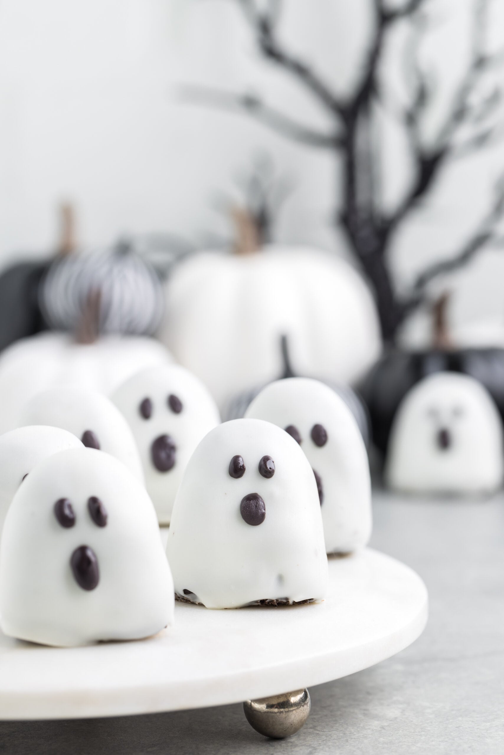 spooky Oreo truffles on a white marble serving tray