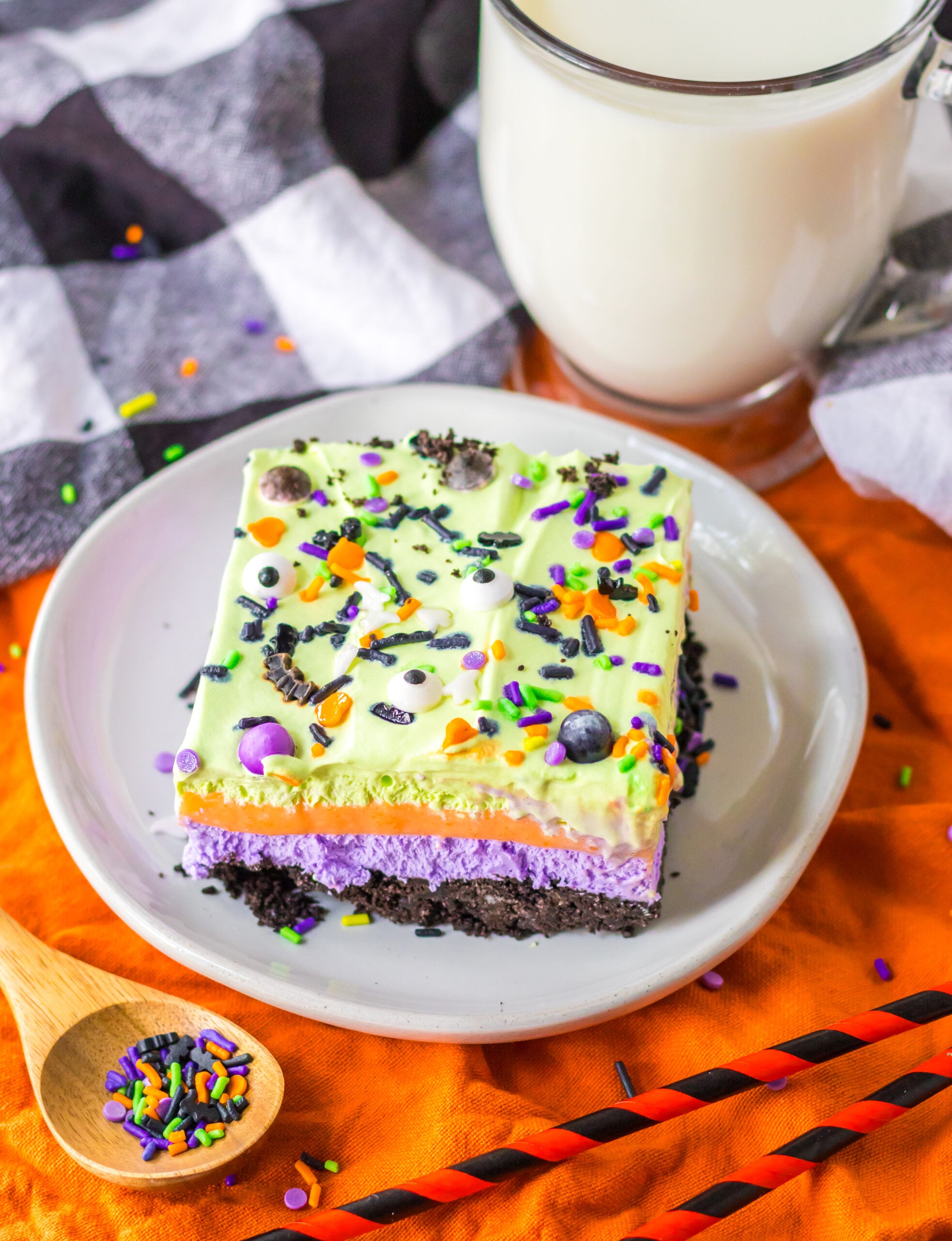 Halloween Lush on a white plate topped with candy eyeballs and halloween colored sprinkles 
