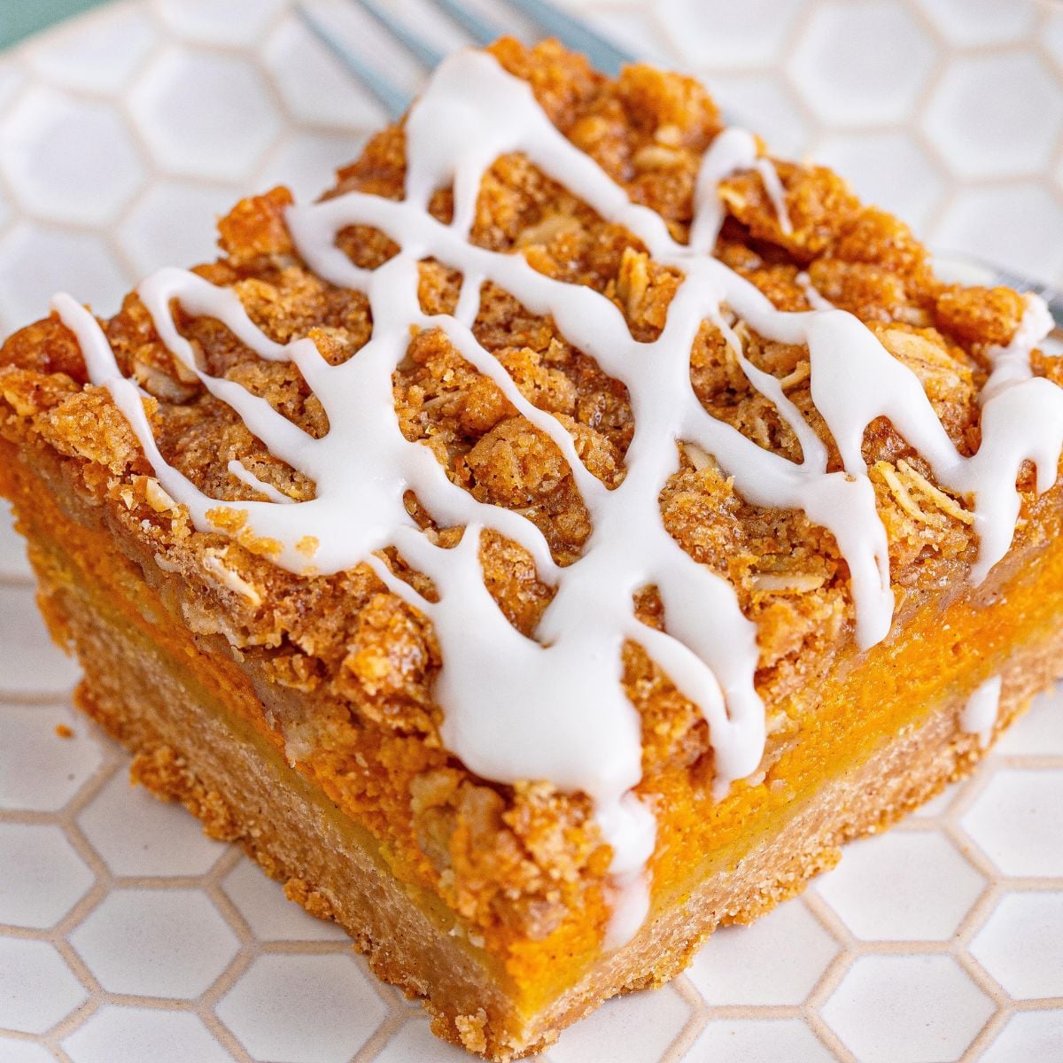 Pumpkin Streusel Bar sliced on a white plate