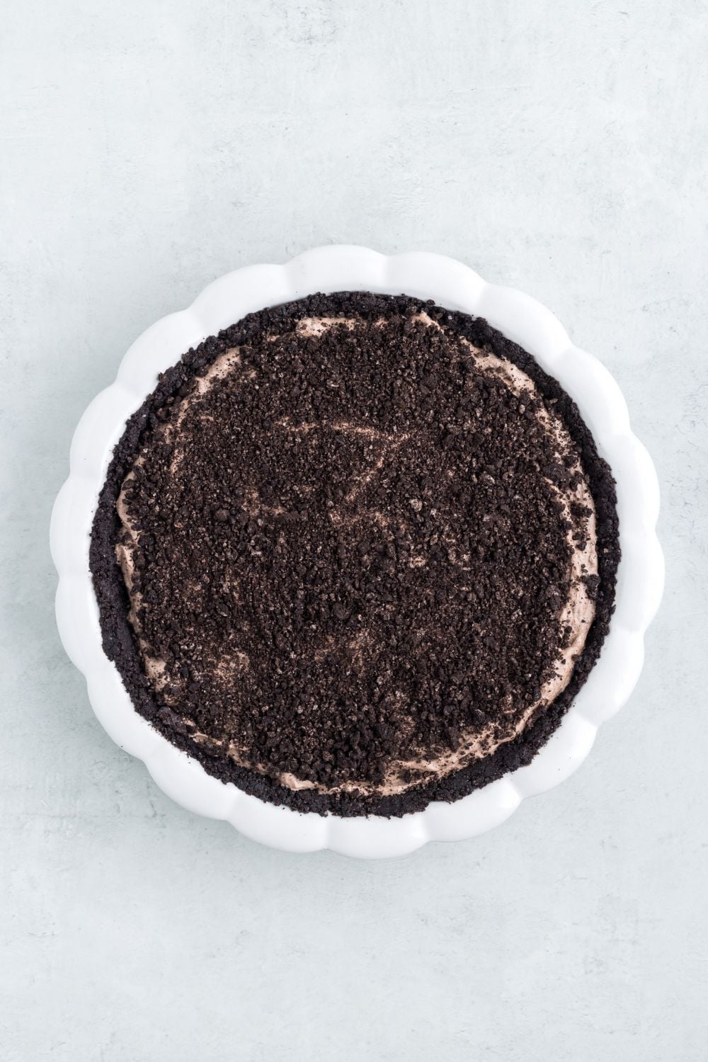 Oreo crumbles on top of the pie 