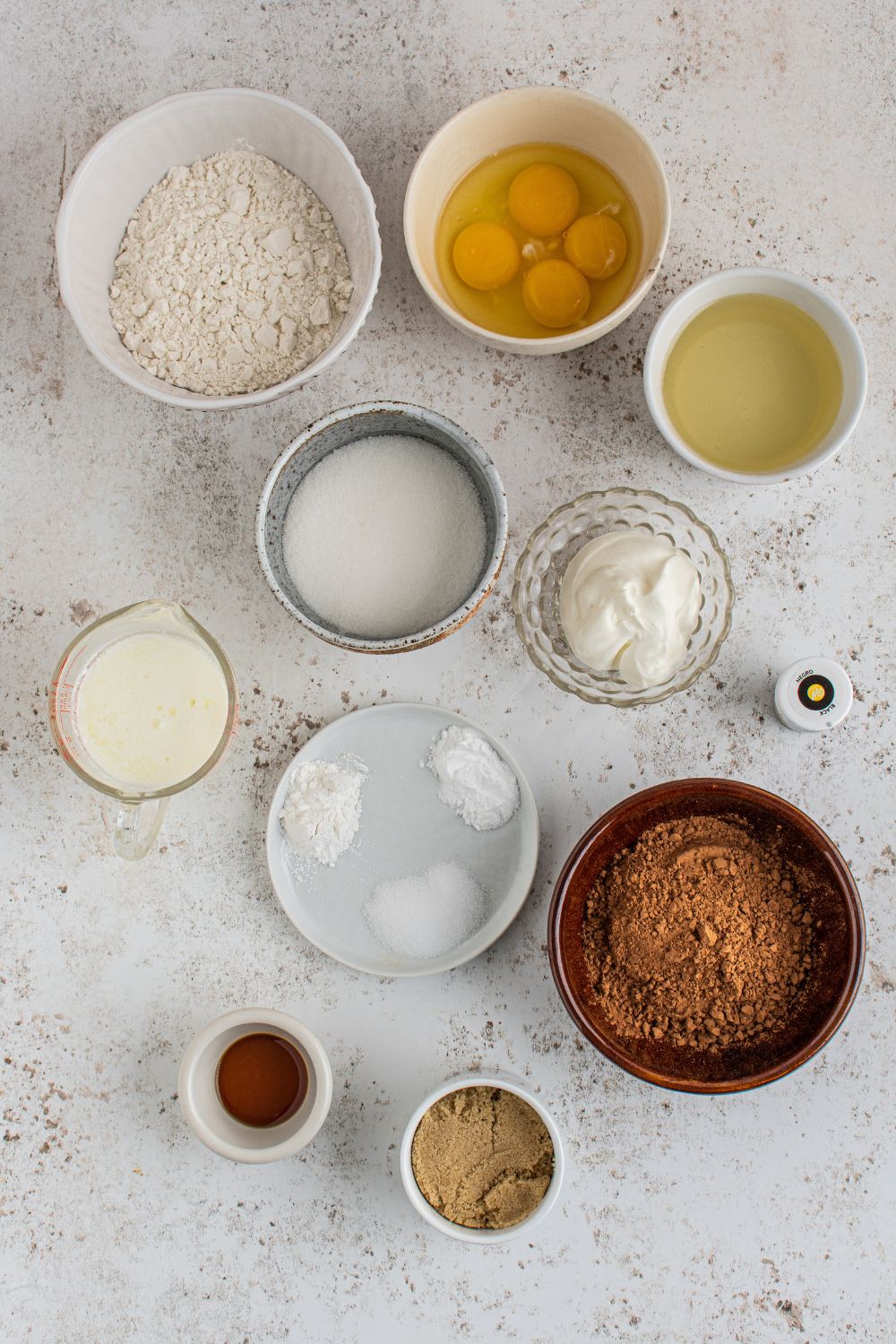 ingredients for chocolate Halloween Cupcakes on marble counter