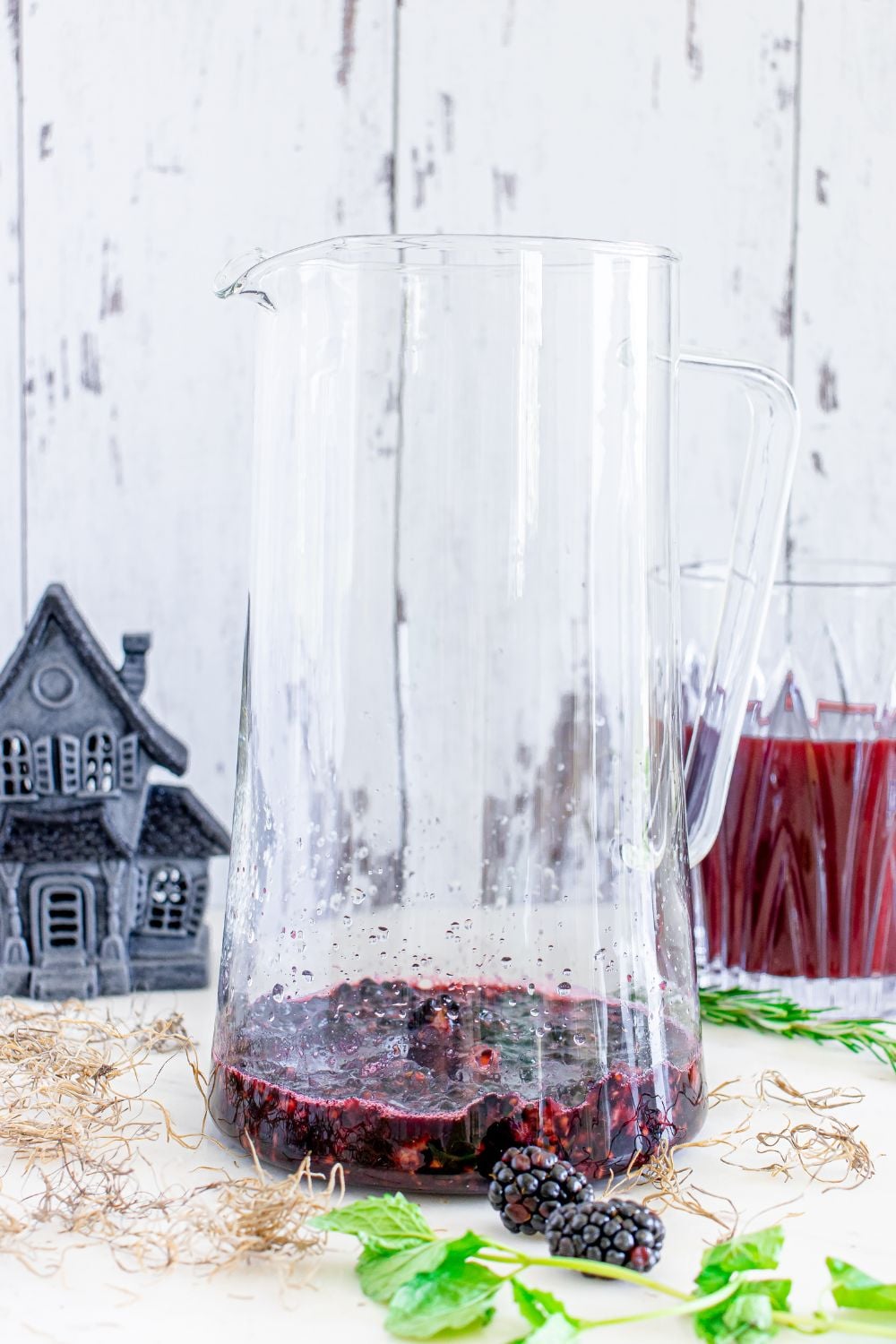 muddled blackberries in glass