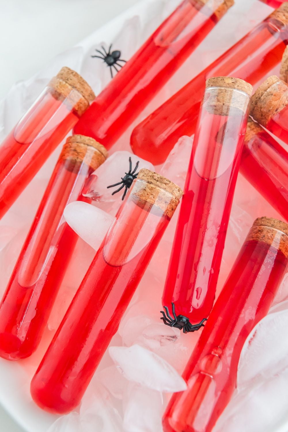 Halloween red colored shots in test tubes on ice cube tray