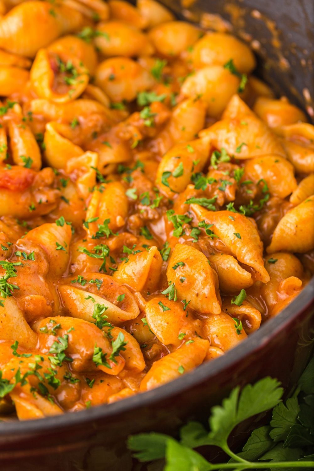 side view of taco pasta in a skillet on counter 