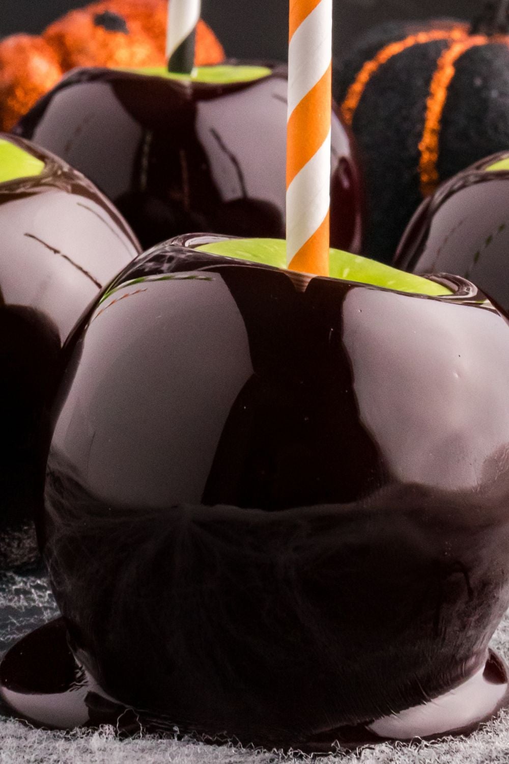 close up of black candy apple