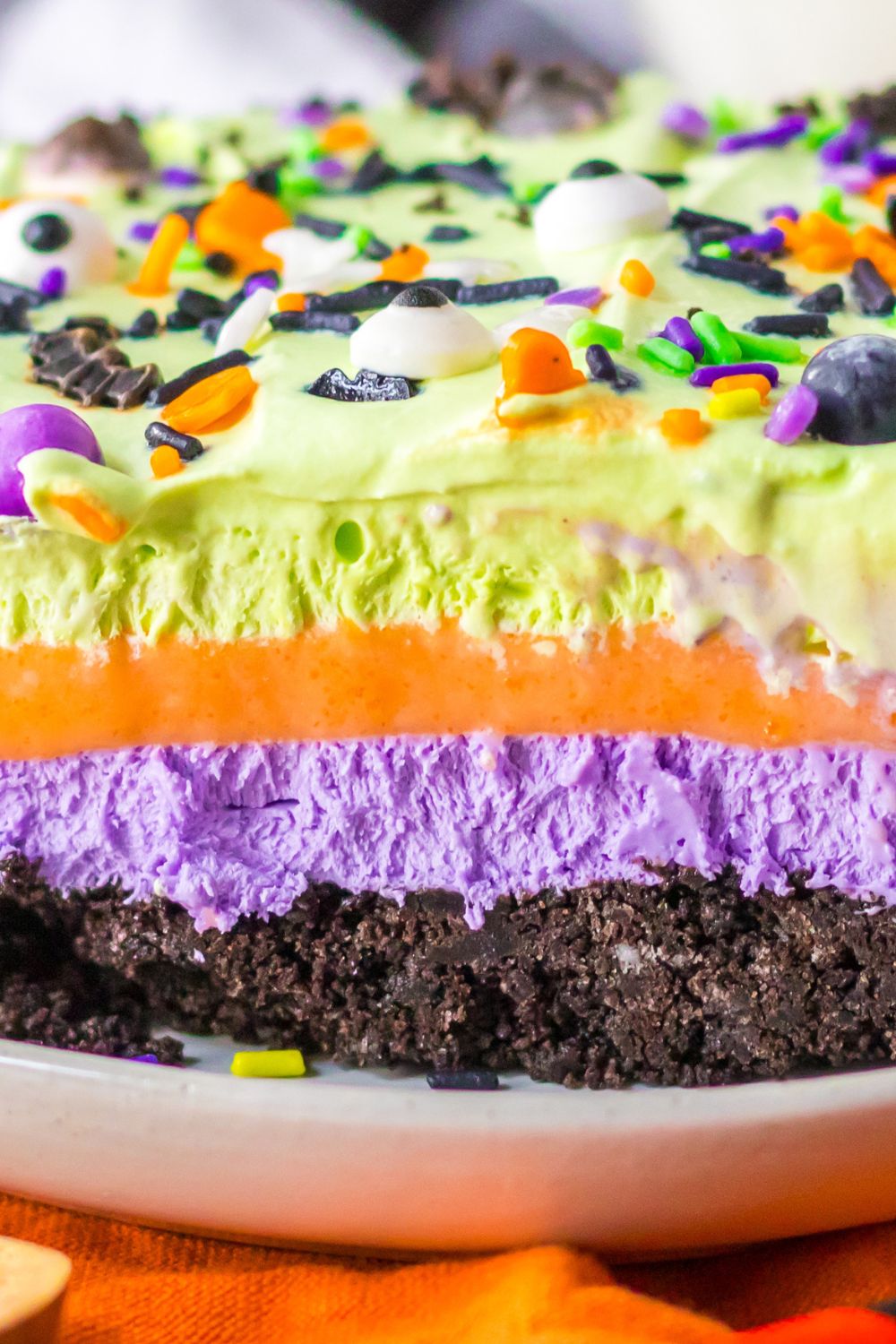 close up of a layered Halloween lush dessert bar on a plate